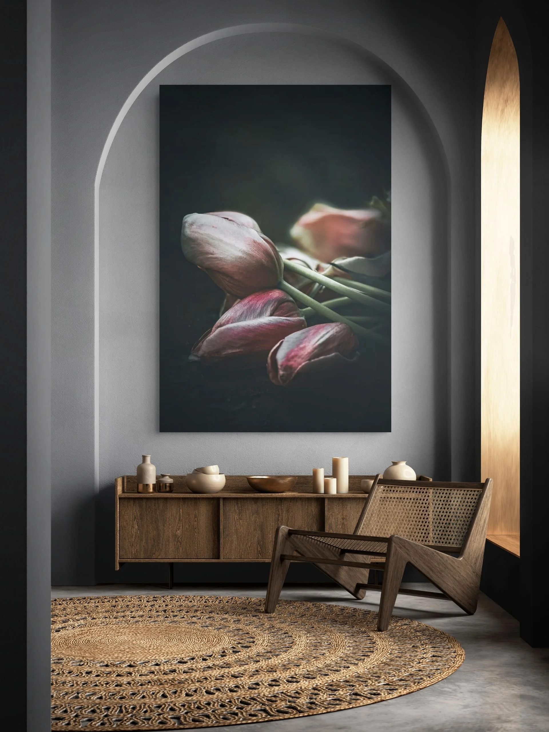 Dark moody fine art still life of wilting tulips, shown as large-format wall art print in a modern interior with arched doorway