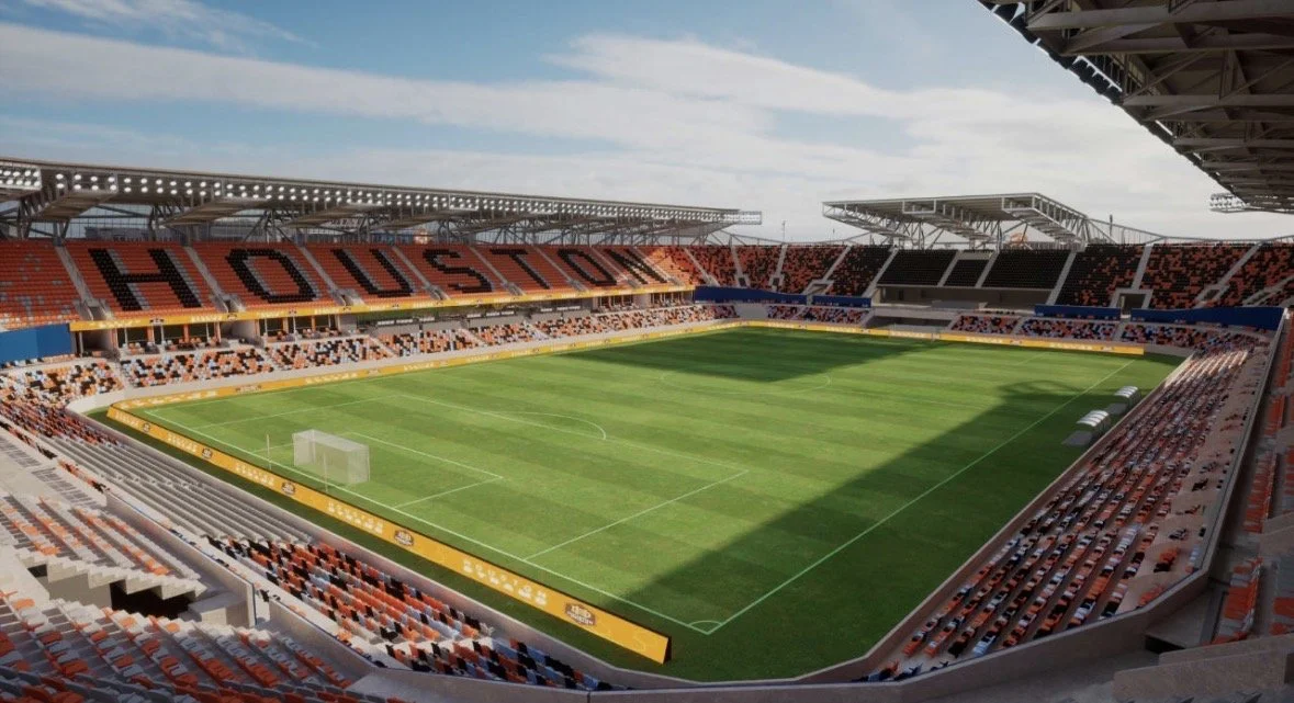 Empty soccer stadium with a field and seats in Houston.
