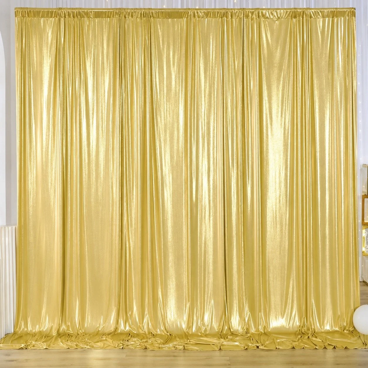 Gold draped backdrop available for Reflections Photo Booth events
