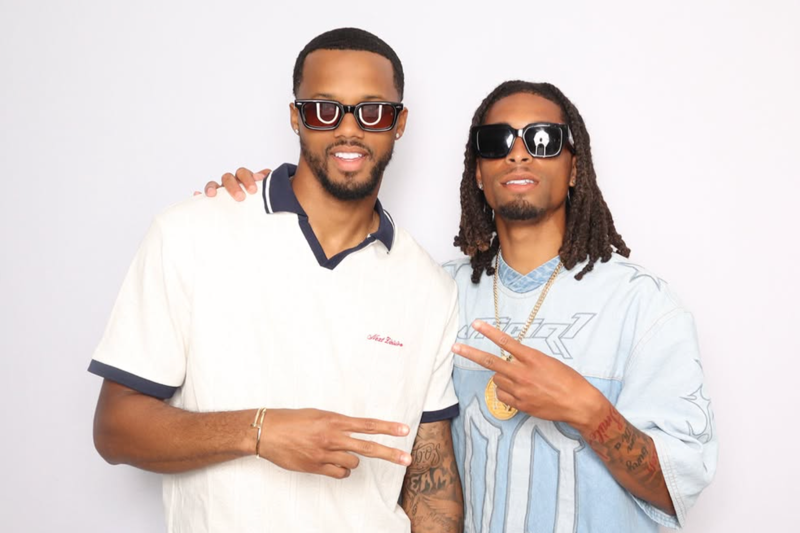Two guests posing together for a studio-quality photo booth portrait