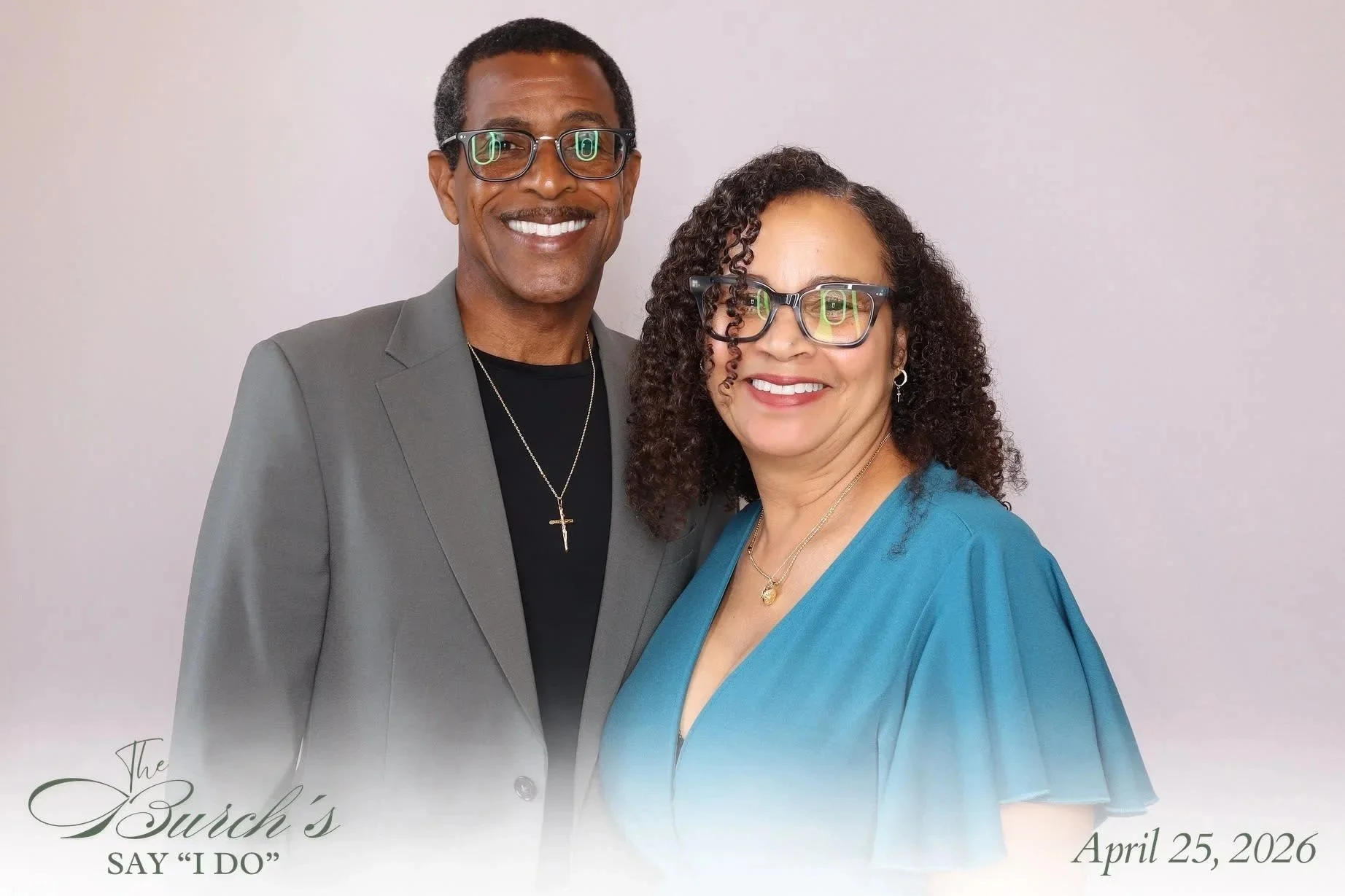 Two guests dressed for an evening event posing together for a Reflections Photo Booth portrait