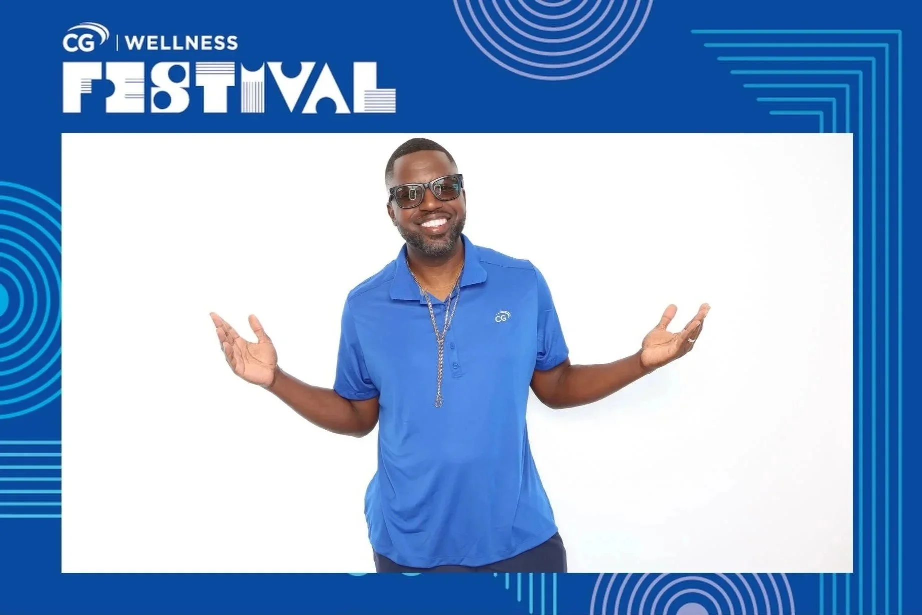 Guest posing in a custom branded photo booth frame at a CG corporate wellness event