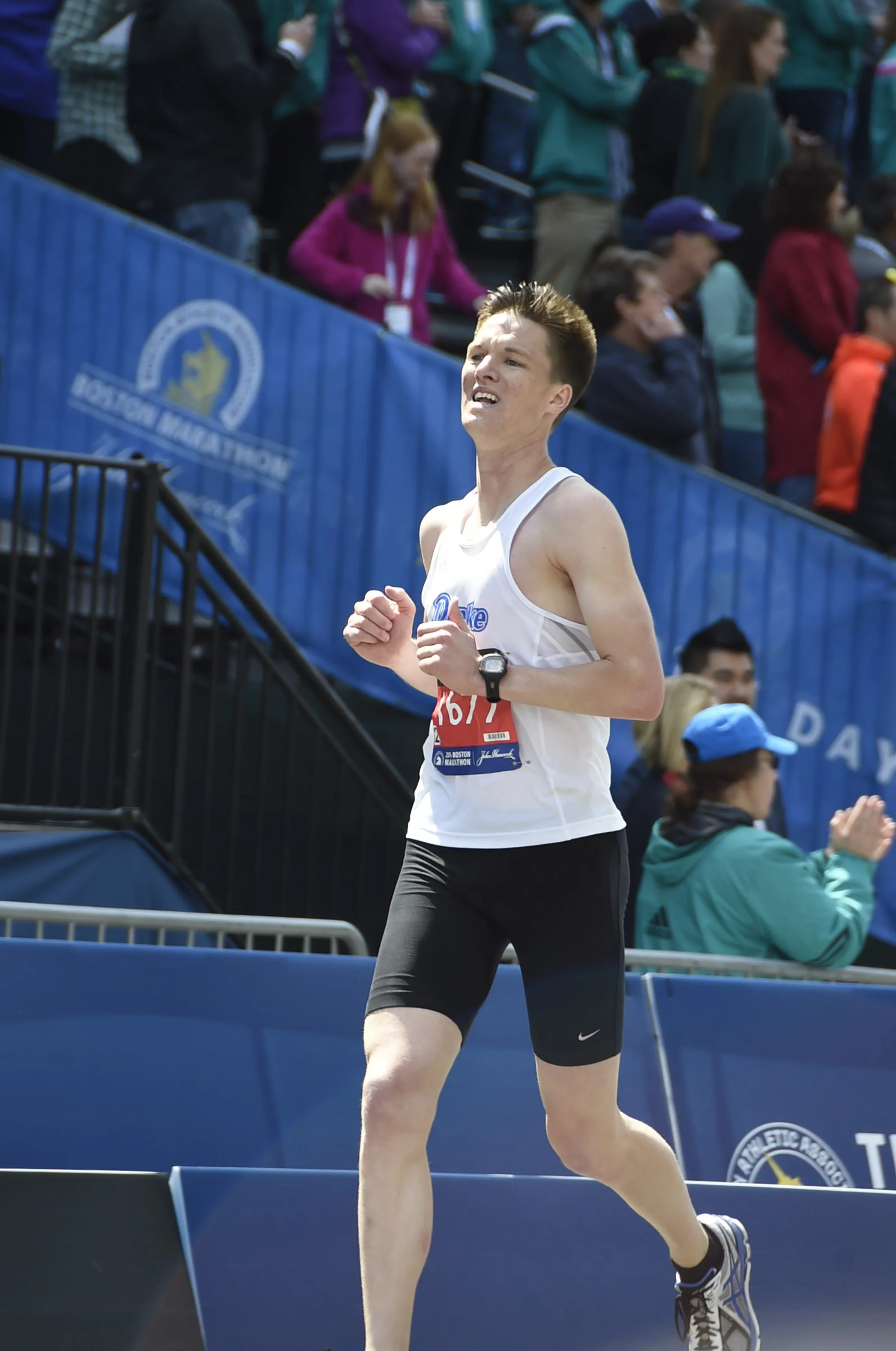 Colin Coomer finishing the Boston Marathon.