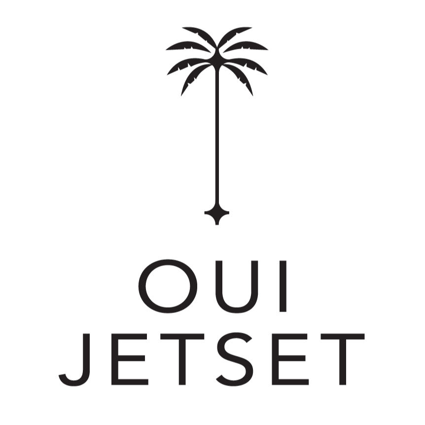 A black and white logo with a palm tree icon and the words 'OUI JETSET' beneath it.