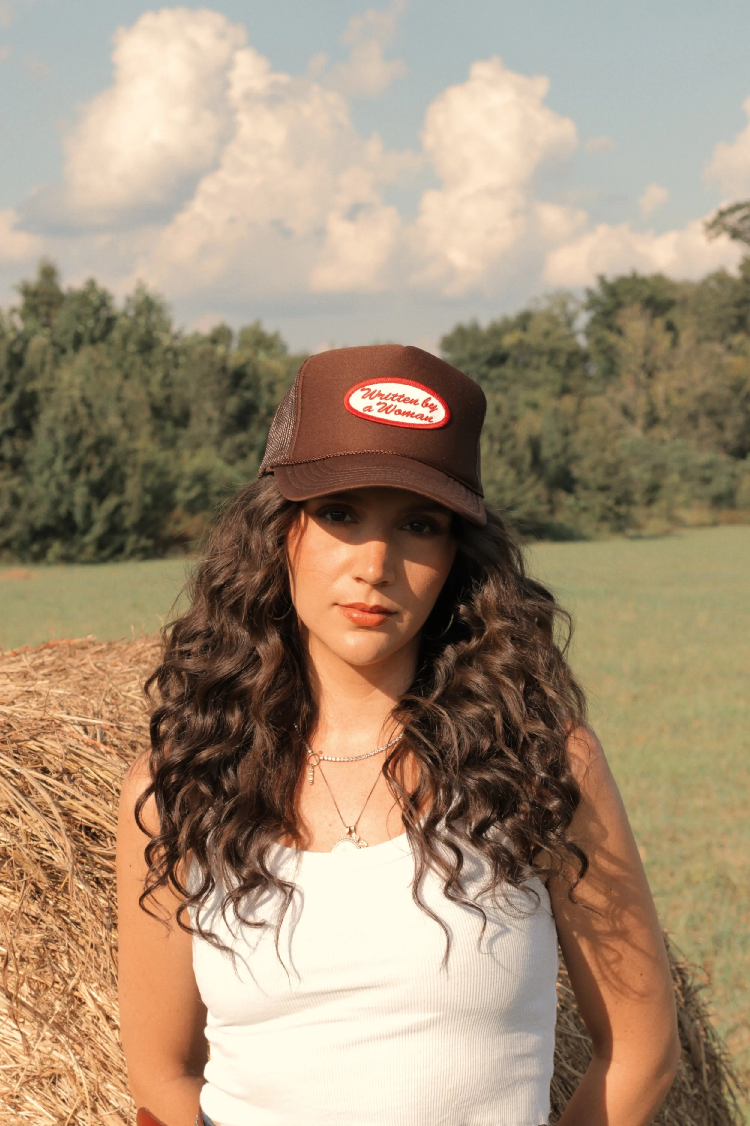 Written By A Woman Trucker Hat