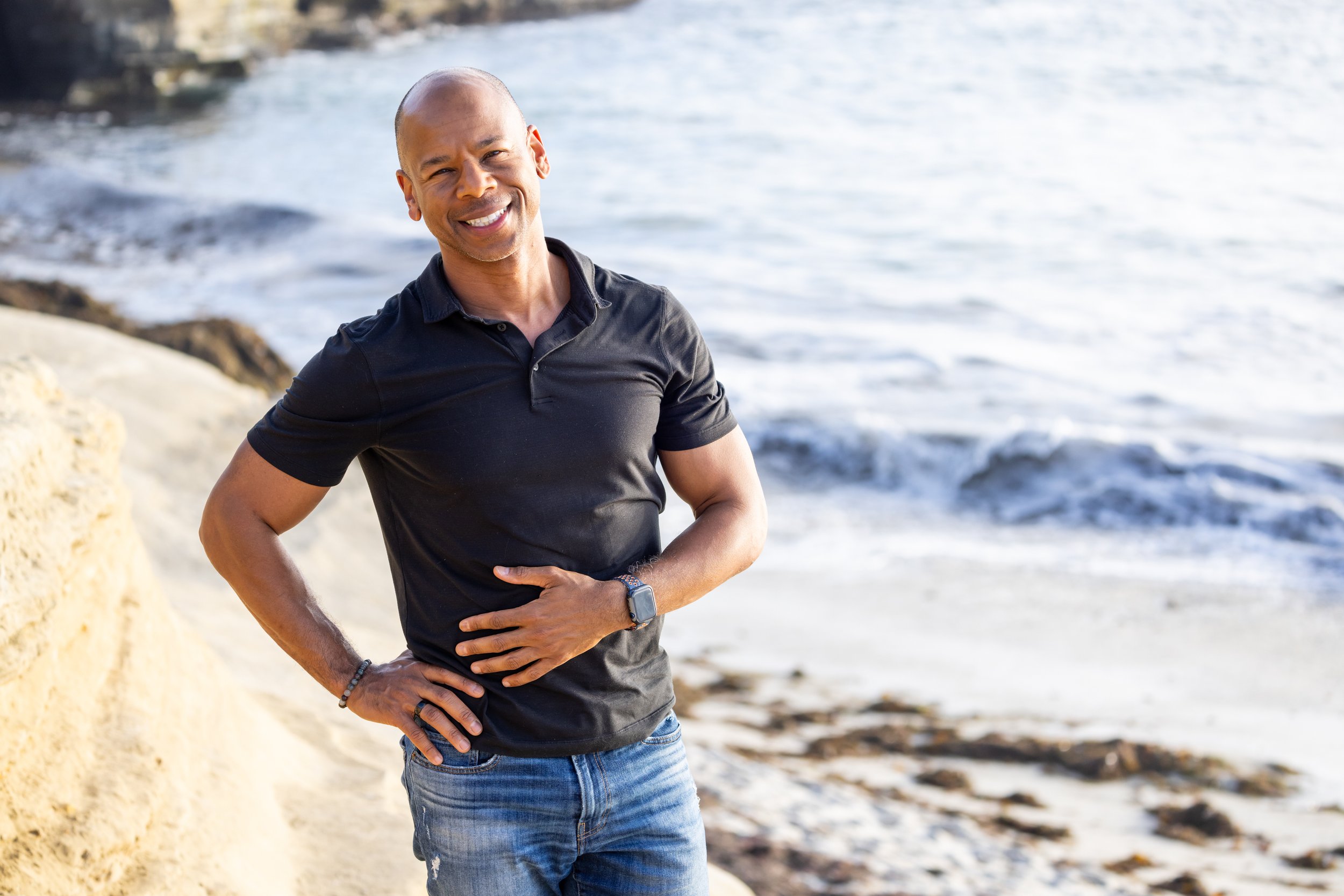 Steven Washington smiling on a beach, author of Recovering You and certified Qigong instructor.