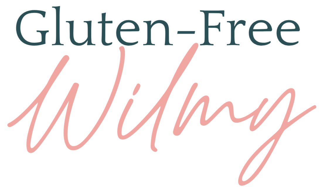 Text reading 'Gluten-Free Wilmy' with 'Gluten-Free' in teal and 'Wilmy' in pink cursive.