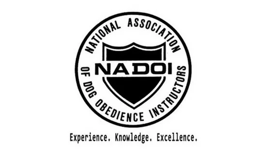 Logo of the National Association of Dog Obedience Instructors (NADOI) with a shield symbol and the tagline 'Experience, Knowledge, Excellence.'
