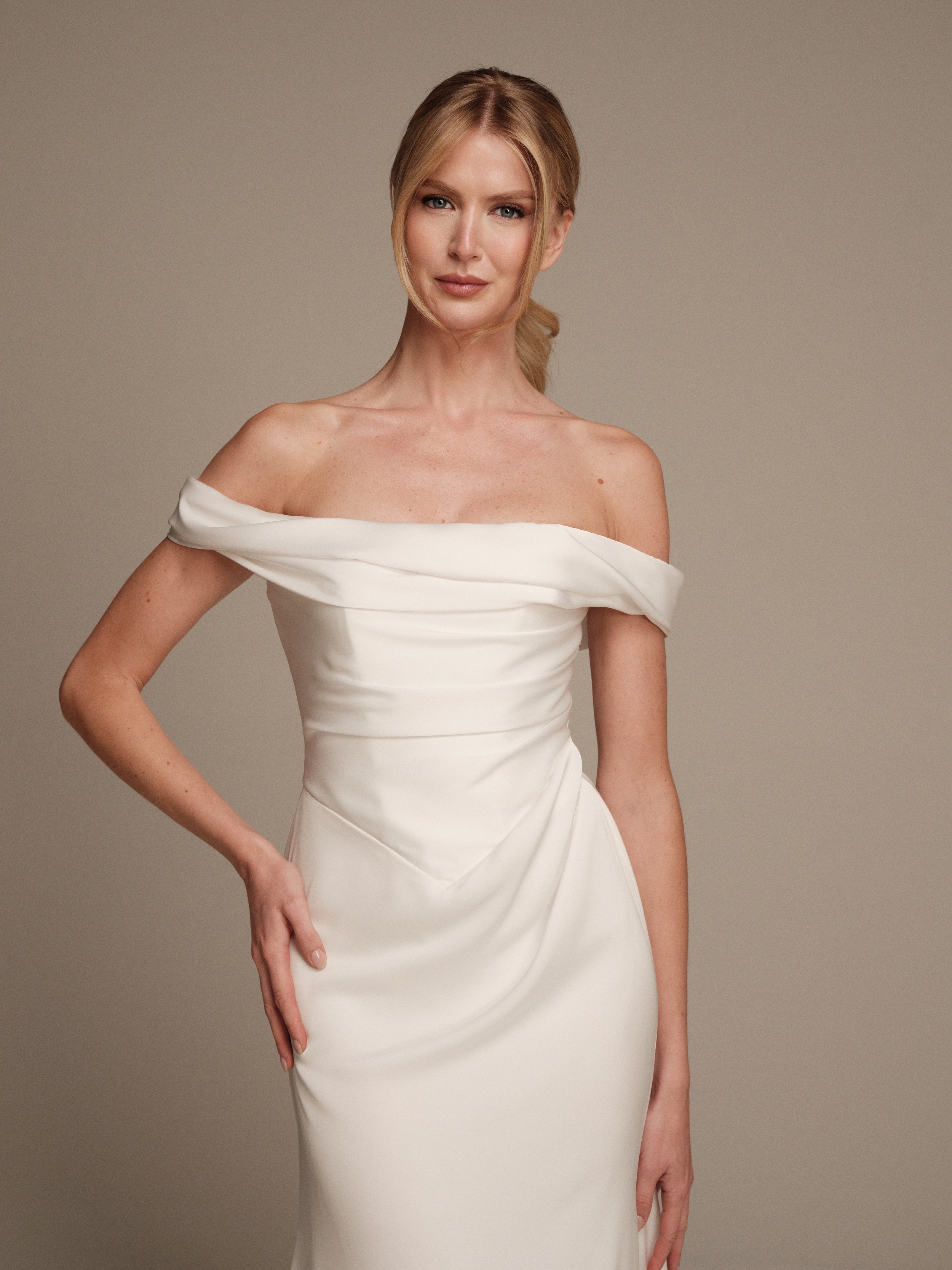 Eos fitted liquid satin wedding gown with off-the-shoulder neckline