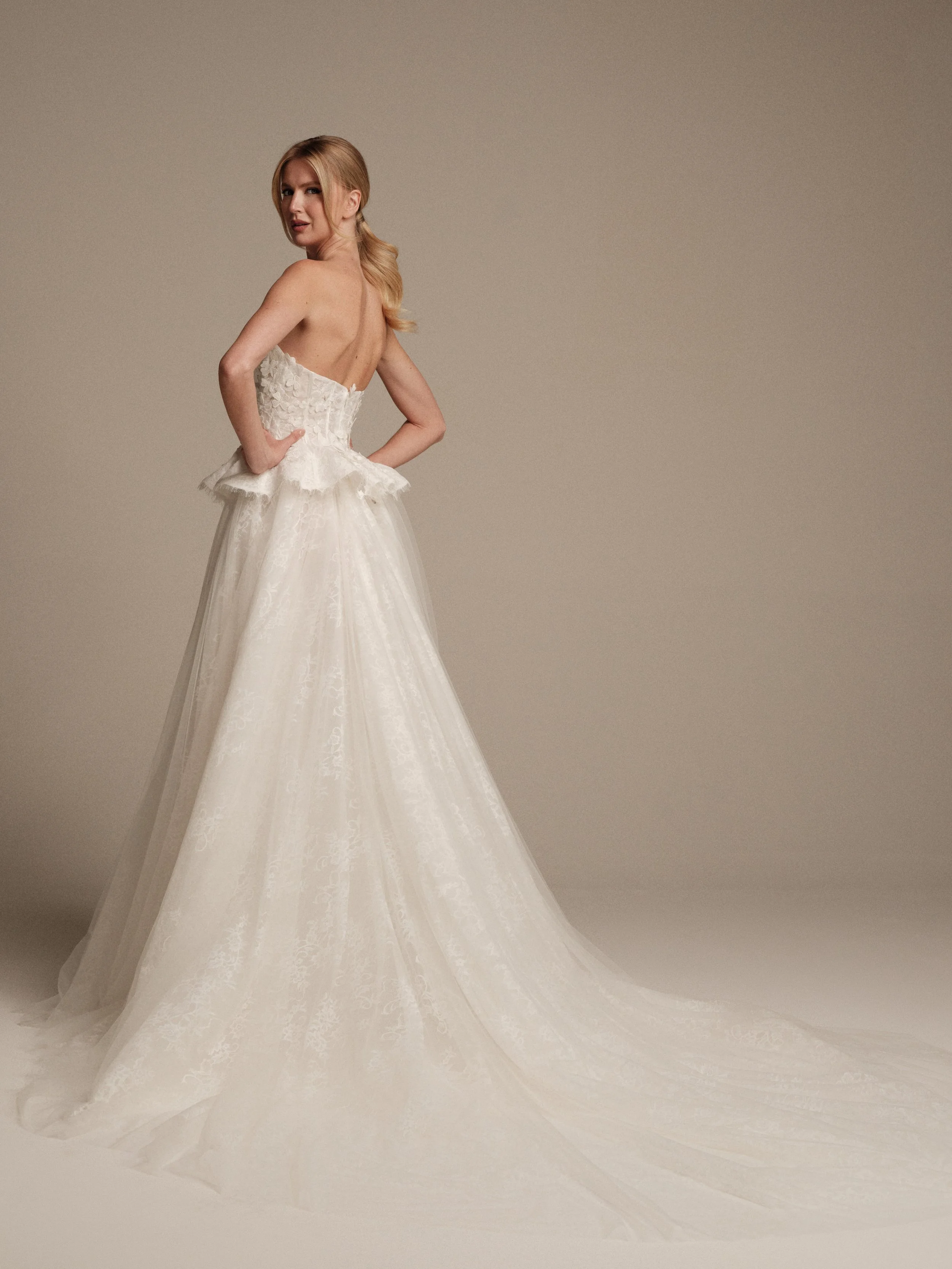 Maria Pia Gaia bridal gown featuring a Chantilly lace skirt and flowing train