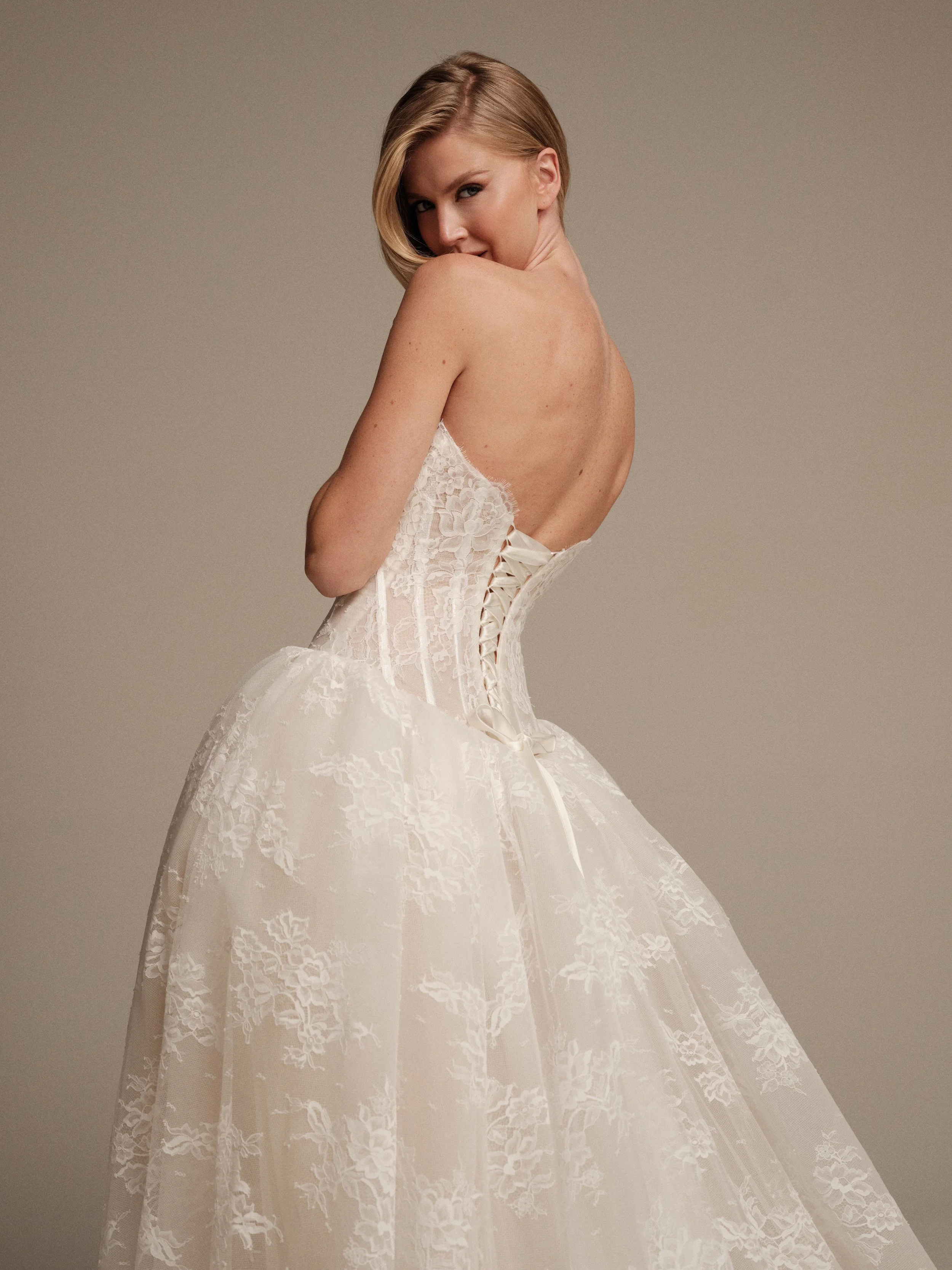Venus Chantilly lace wedding gown with lace-up corset back and full skirt