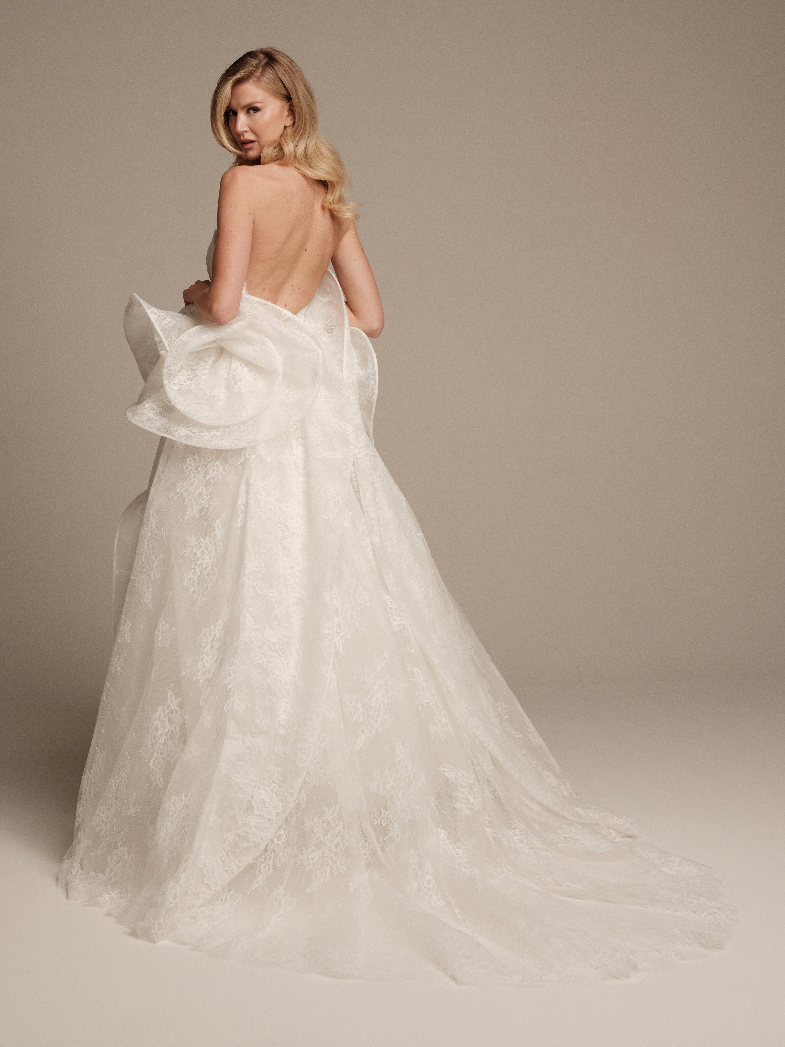 Ceres Chantilly lace bridal gown with open back and sweeping train