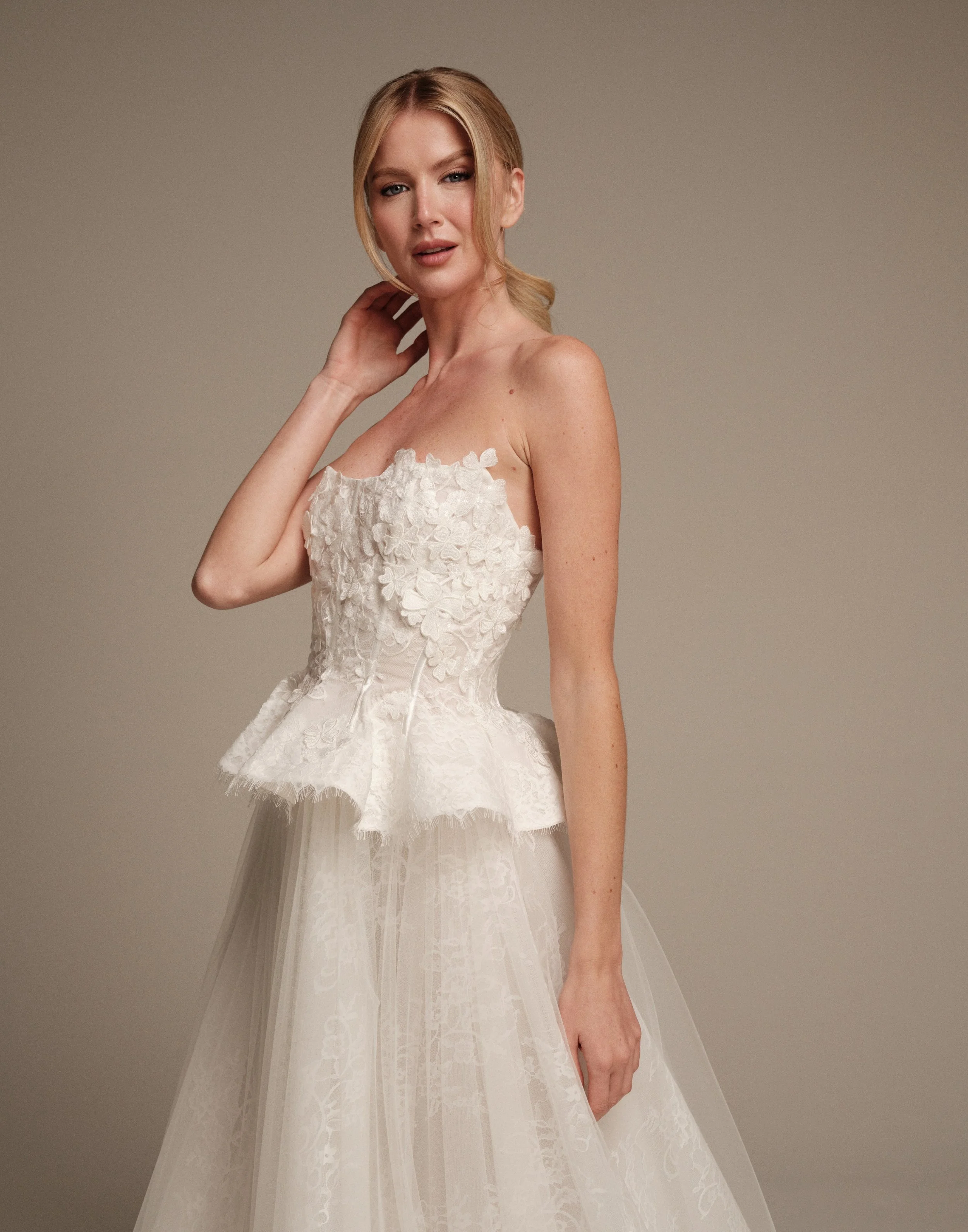 Maria Pia Gaia wedding dress with 3D floral petals on a structured Chantilly lace bodice