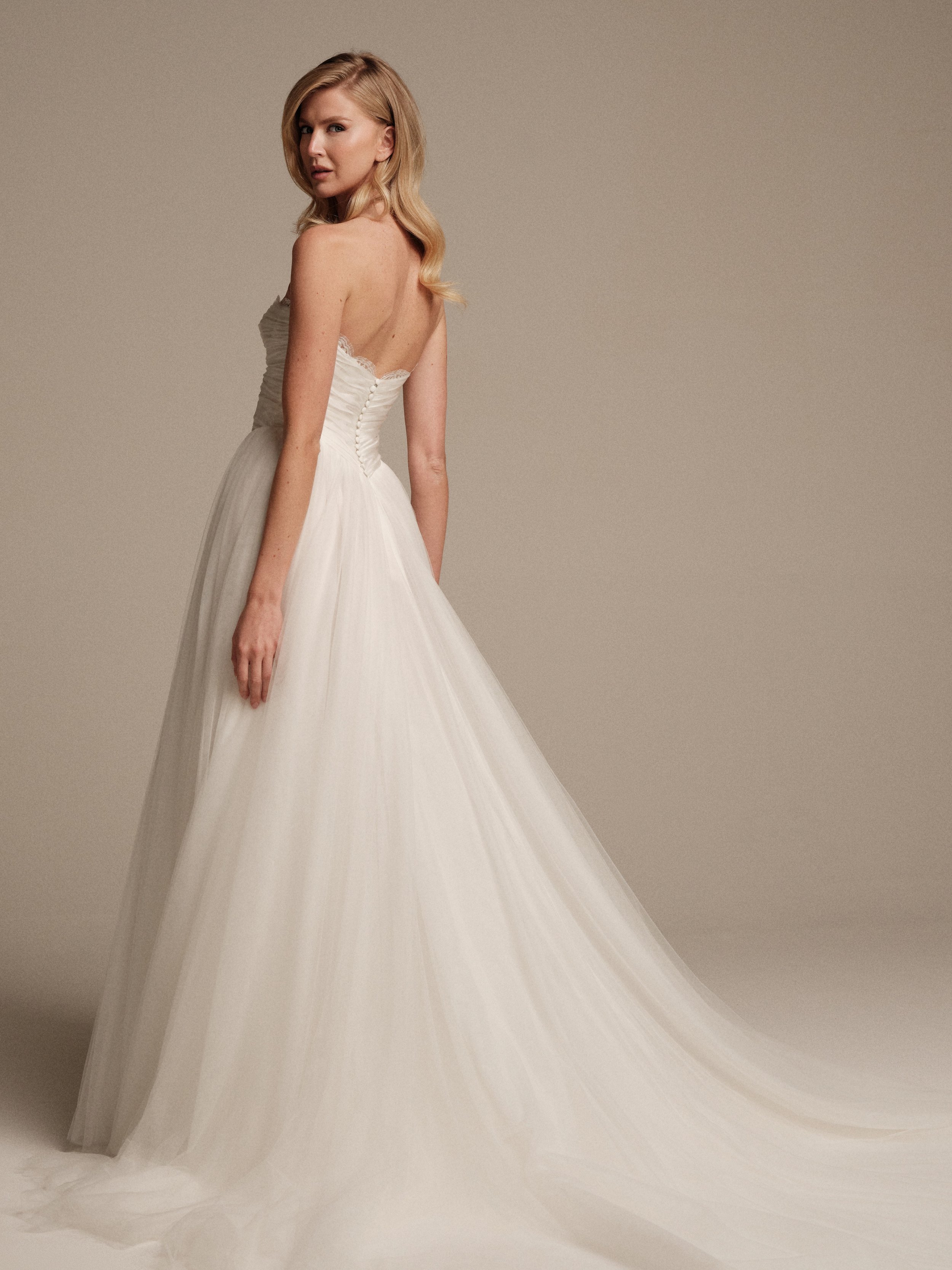 Aura bridal gown with lightweight flowing skirt and sweeping train