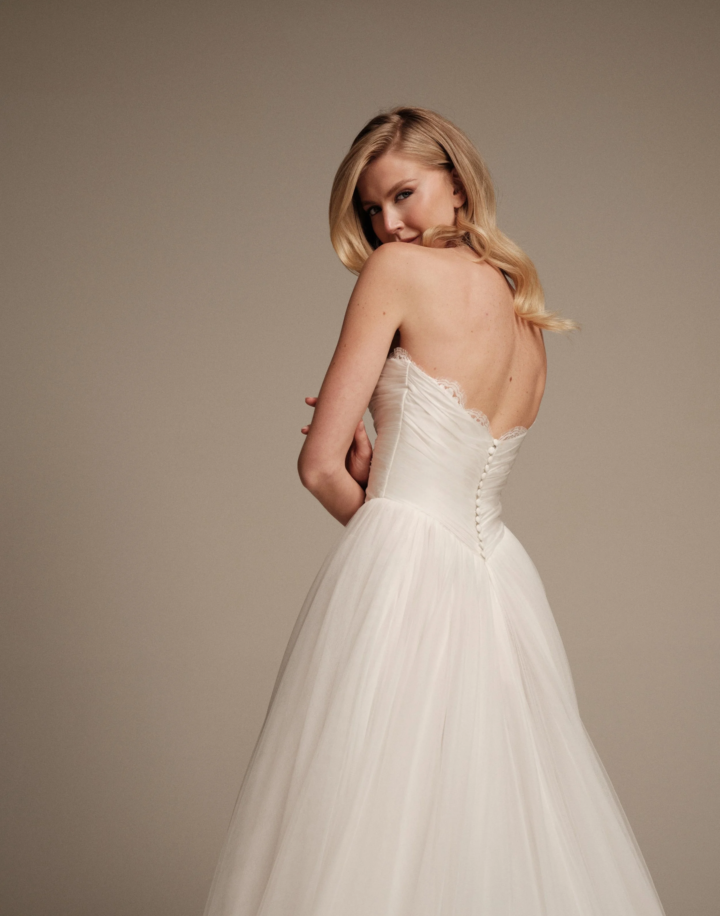 Maria Pia Aura bridal gown with low back and fabric-covered buttons