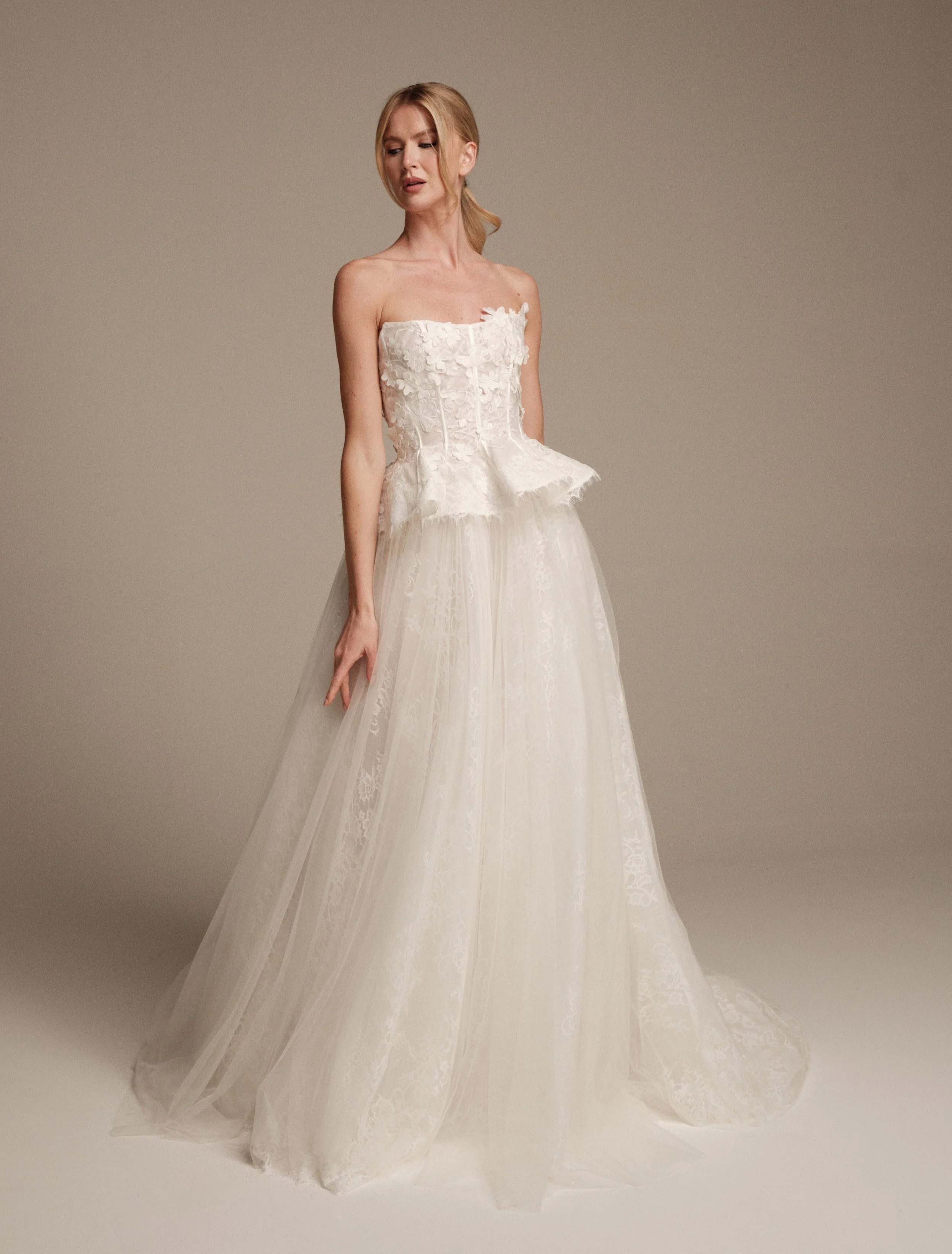 Gaia by Maria Pia, strapless Italian lace wedding dress with a sculpted peplum bodice and soft A-line skirt