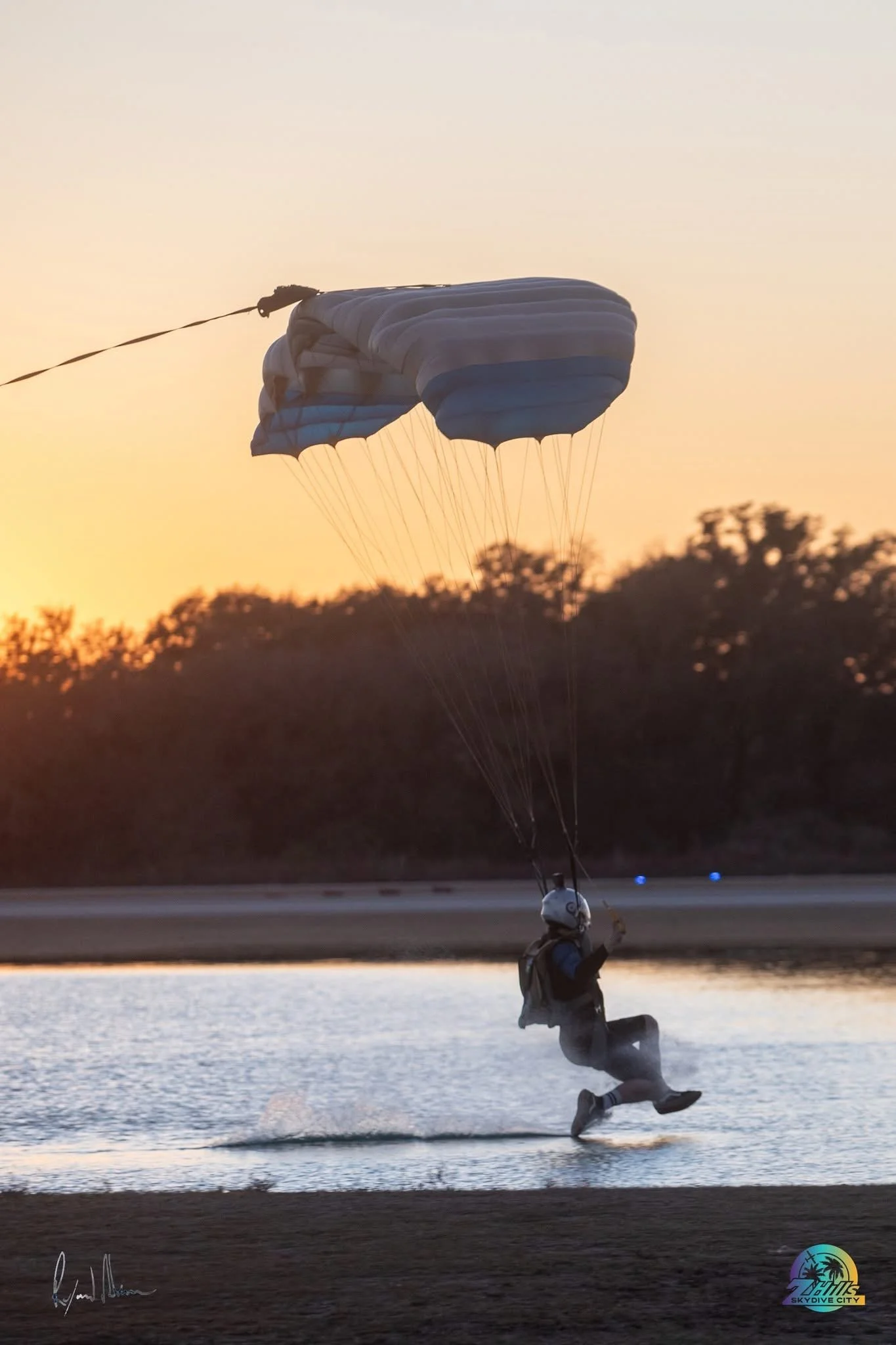 Frankie, Shred XP coach, flying low over the pond at Skydive City
