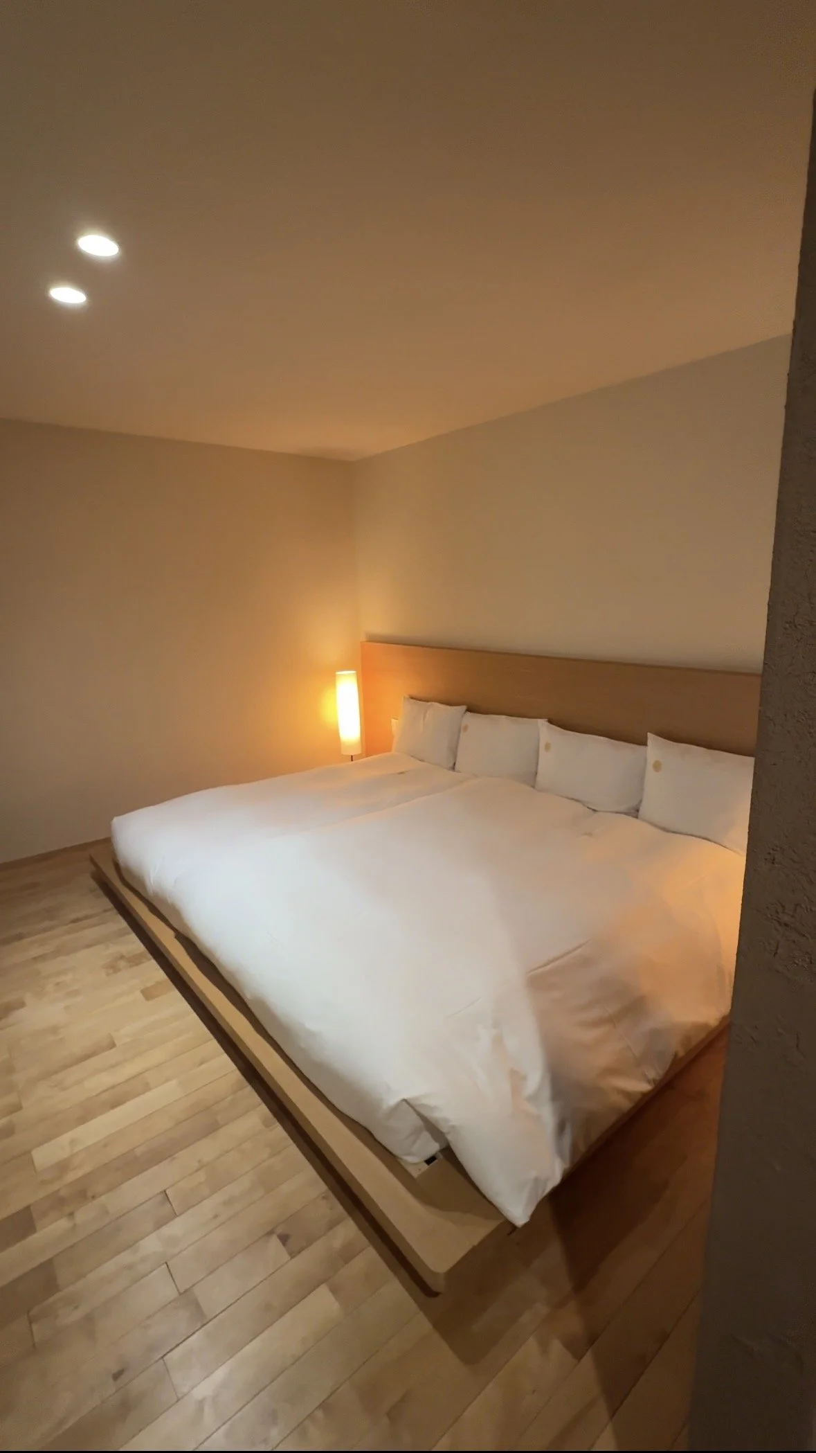 Minimalist bedroom in a private onsen suite at Kinnotake Tonosawa, Hakone