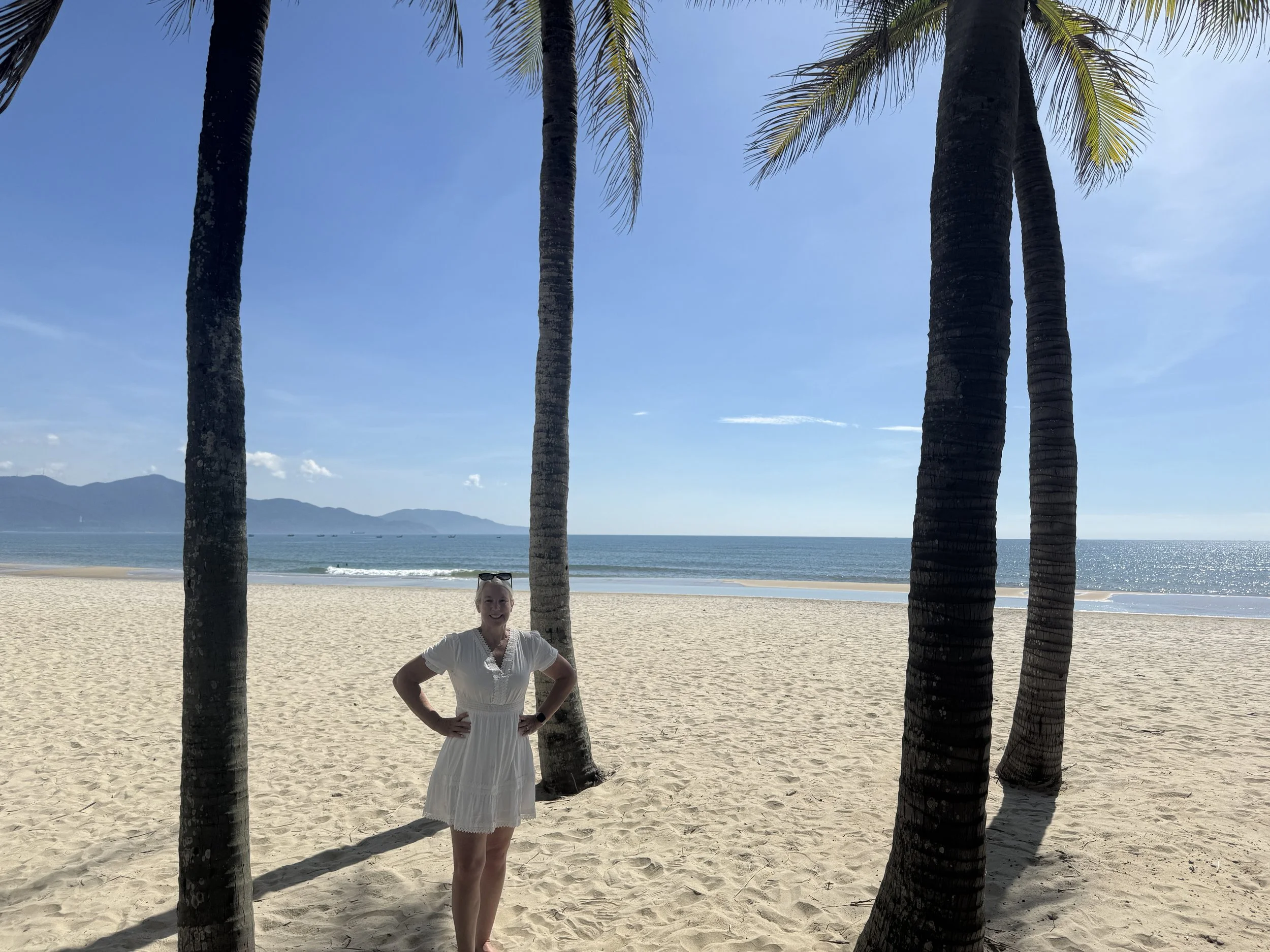 Palm trees and sandy beach outside the beachfront villas at Hyatt Regency Danang Resort & Spa