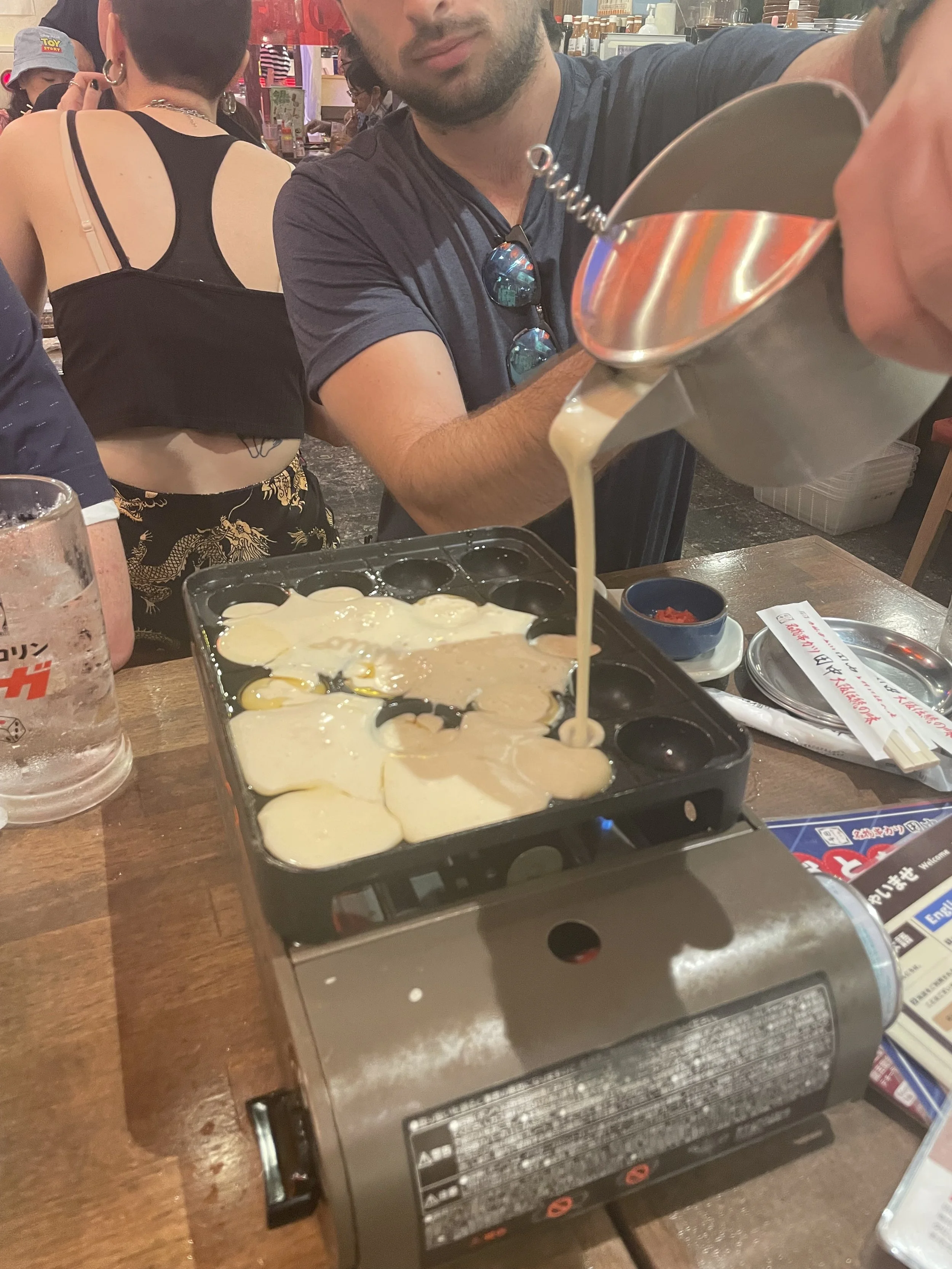 Fresh takoyaki being prepared at a restaurant in Naha Okinawa
