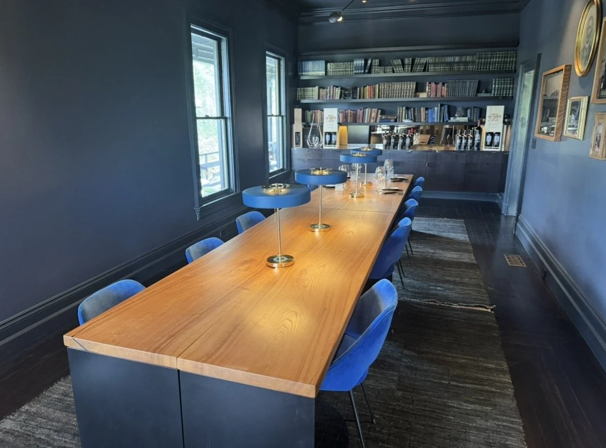 Private tasting room with long wooden table inside Faust Haus in Napa Valley