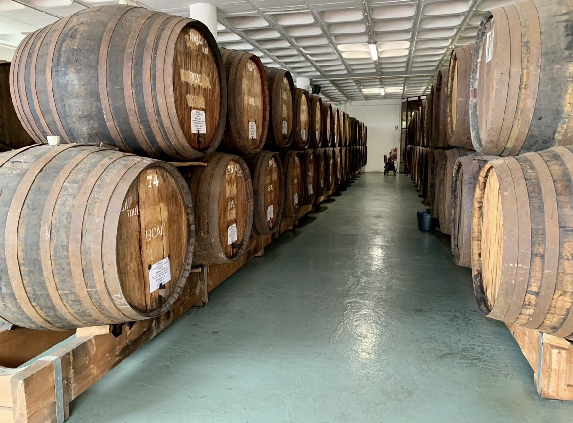 Historic Madeira wine barrels aging at Henriques & Henriques winery.