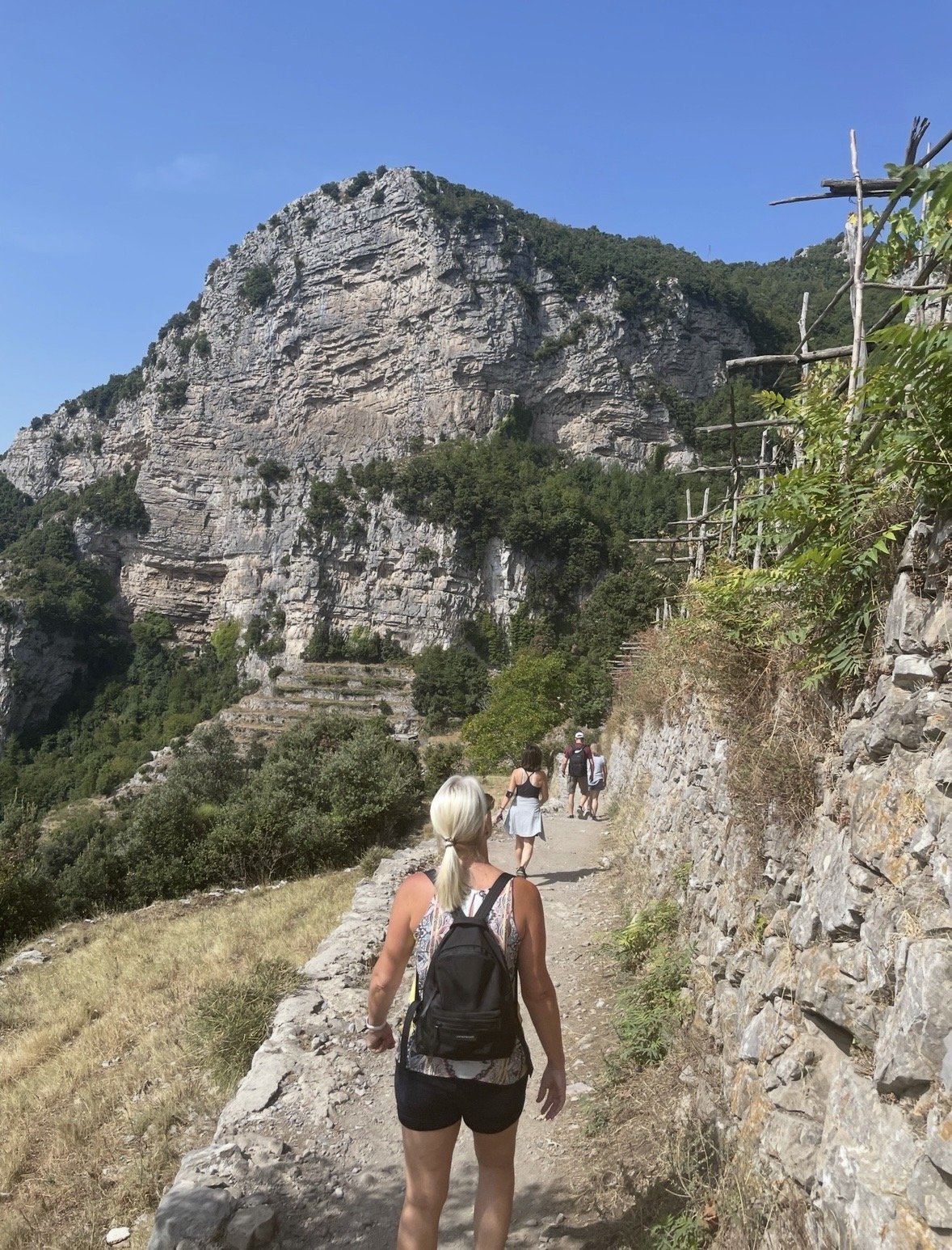 Hiker walking along the Path of the Gods overlooking the Amalfi Coast