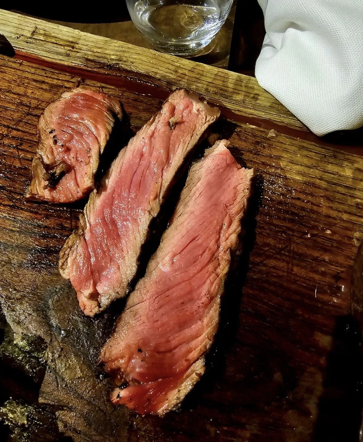 Rare sliced Florentine steak showing pink center at L'Ortone in Florence Italy