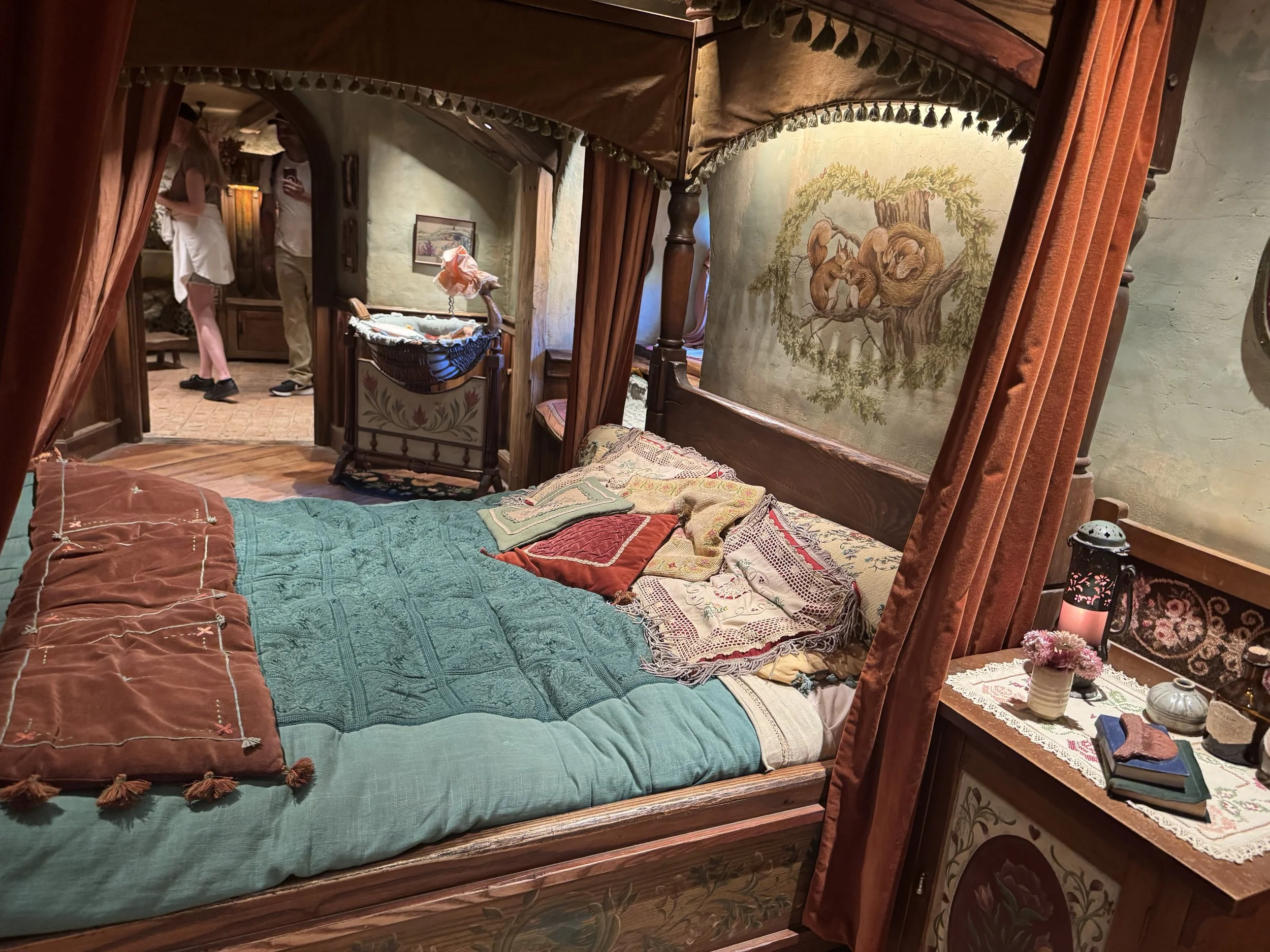 Hobbit bedroom with handcrafted furniture inside Hobbiton Movie Set