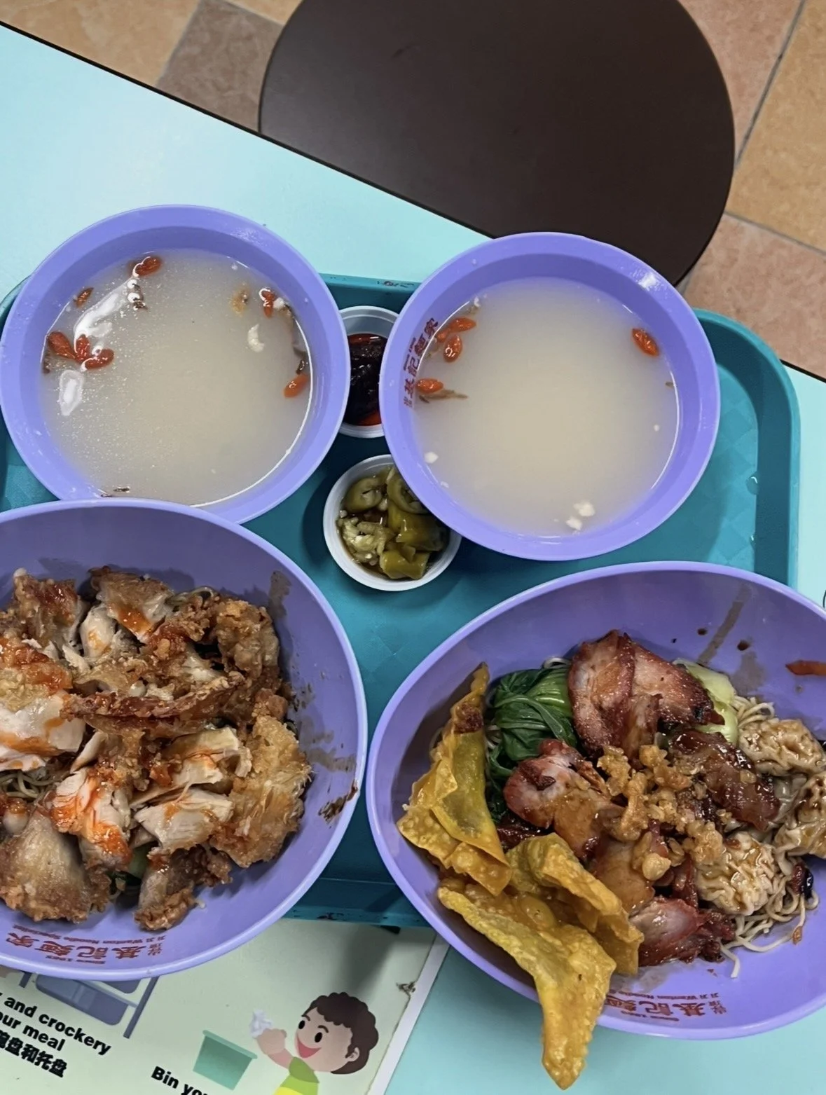 Ji Ji Noodle House wonton noodles with roasted chicken, char siu, dumplings, and soup at a Singapore hawker centre
