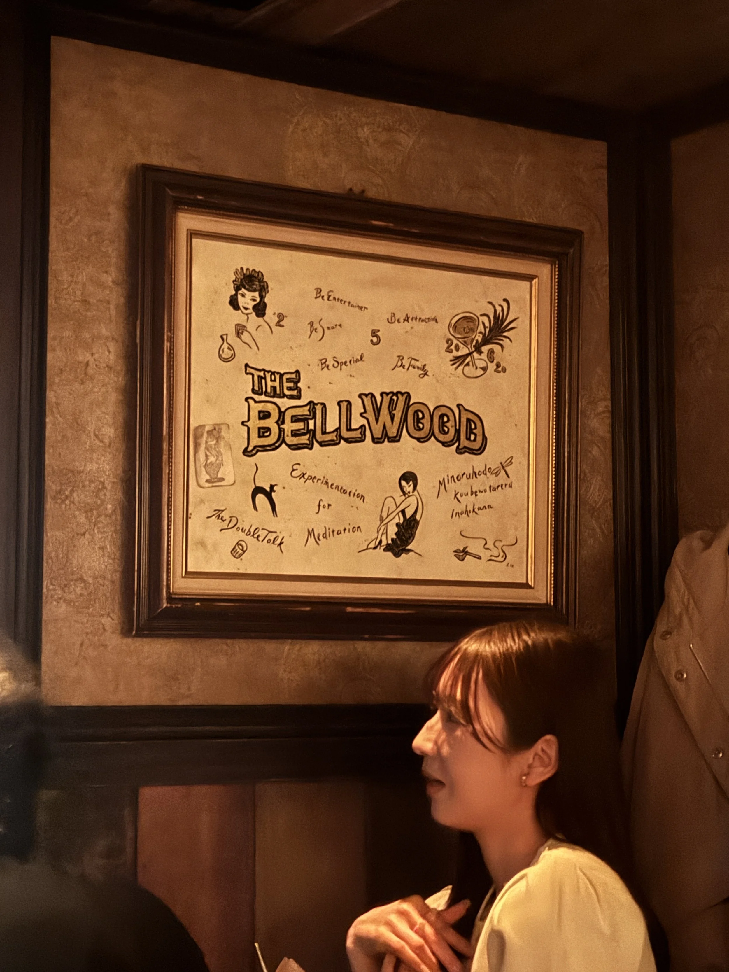 Bellwood Tokyo interior featuring the iconic Bellwood sign and cozy seating