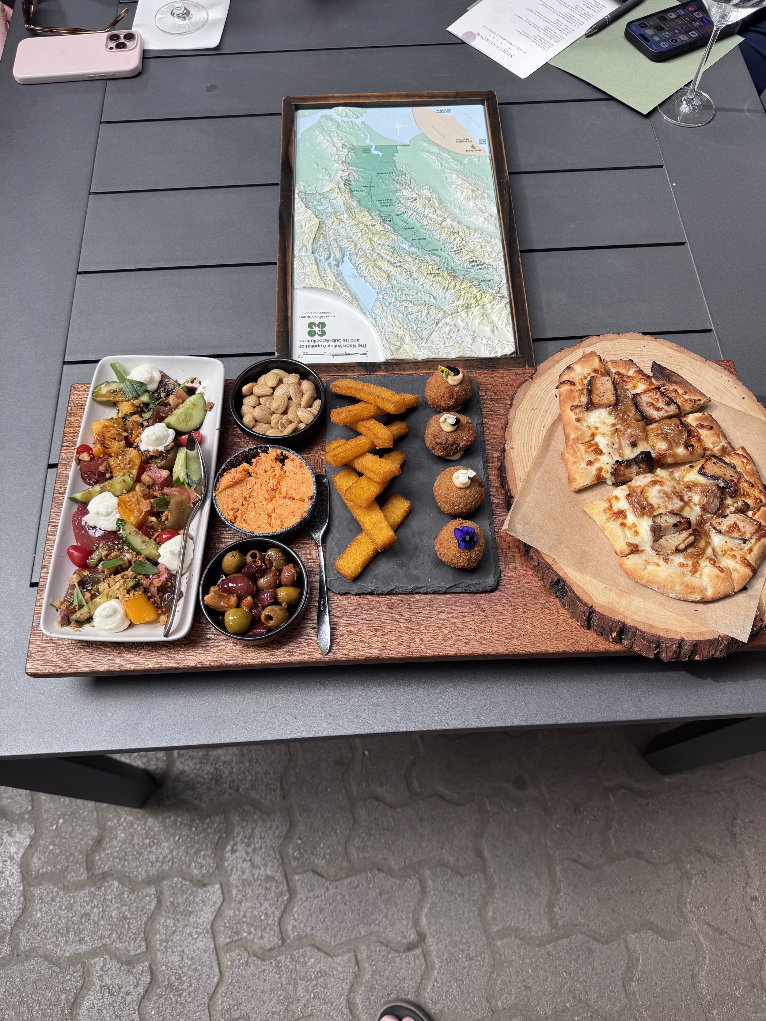 Sequoia Grove Winery food pairing featuring flatbread, mushroom arancini, polenta fries, olives and heirloom tomato salad in Napa Valley.