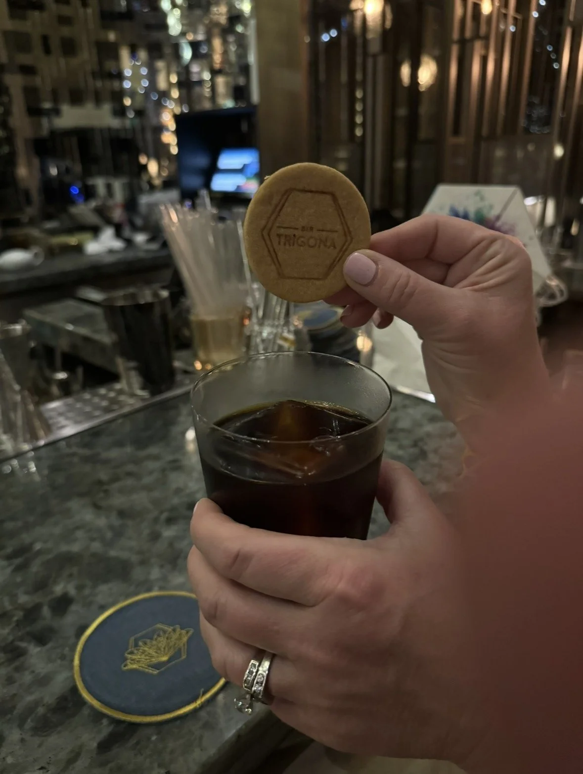Bar Trigona cocktail served with a branded Trigona cookie