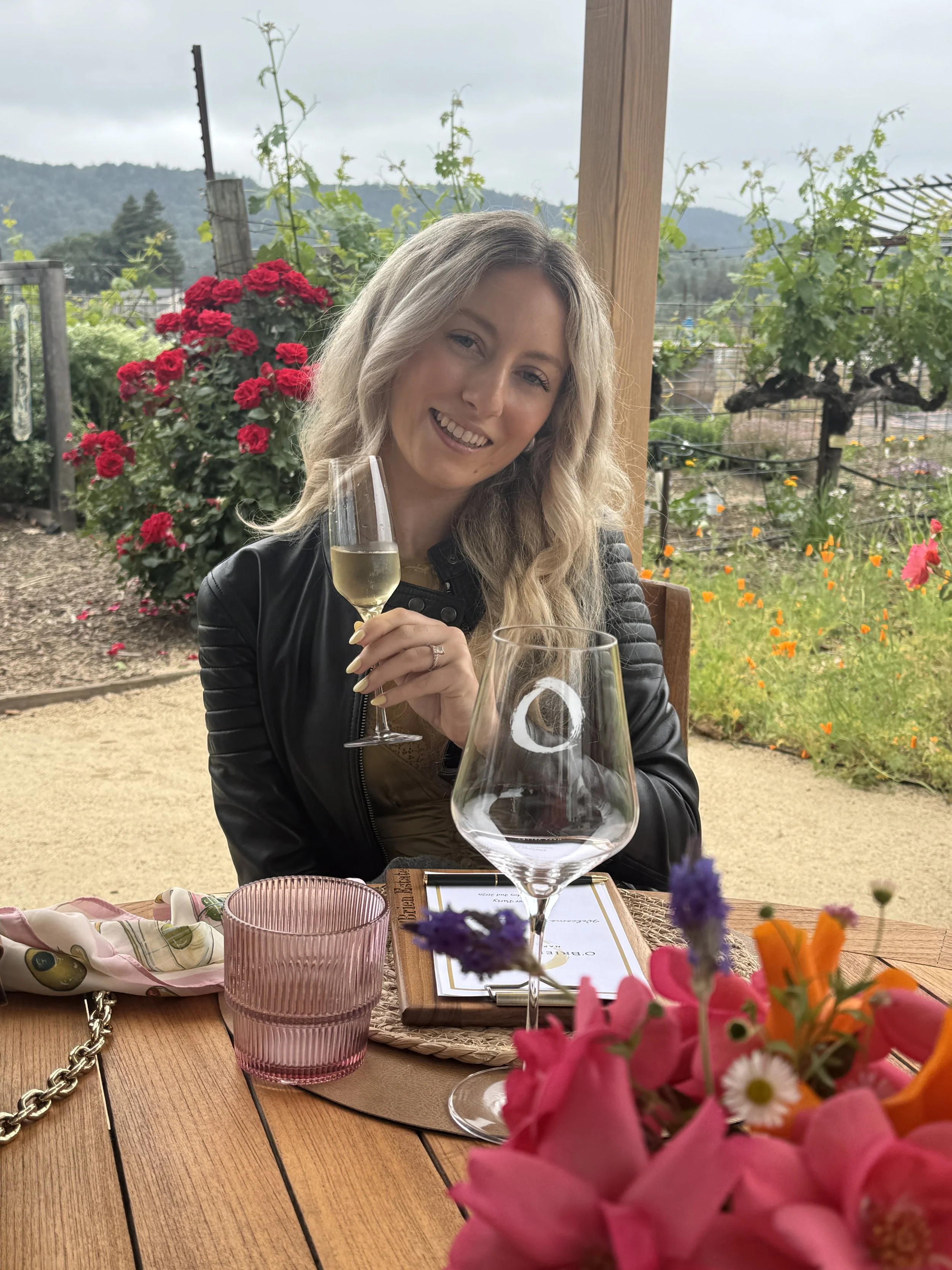 Wine tasting at O'Brien Estate in Napa Valley overlooking vineyard gardens