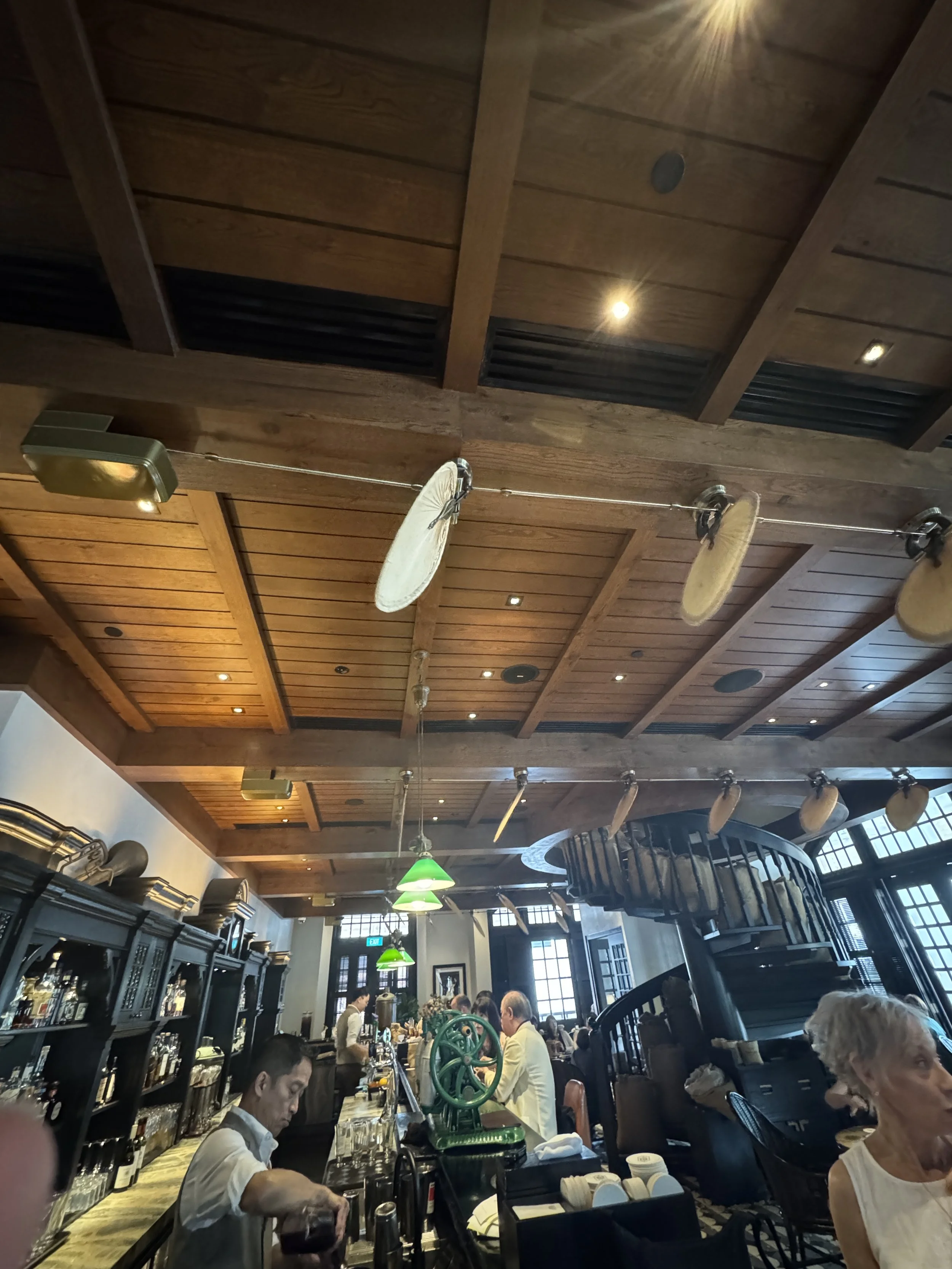 Wide interior view of Long Bar at Raffles Singapore