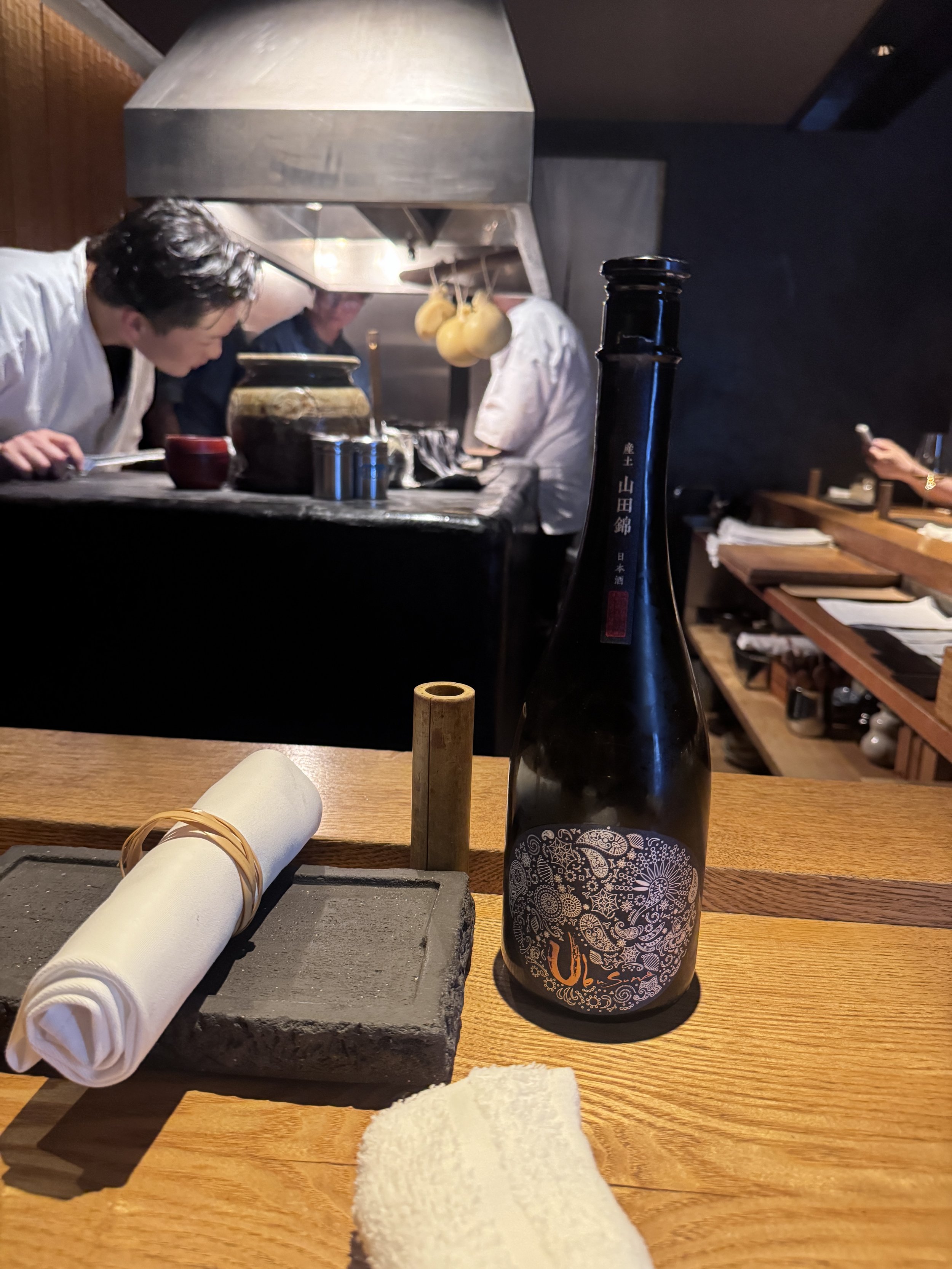 Chef preparing yakitori at Michelin-starred Yakitori Ichimatsu in Osaka.