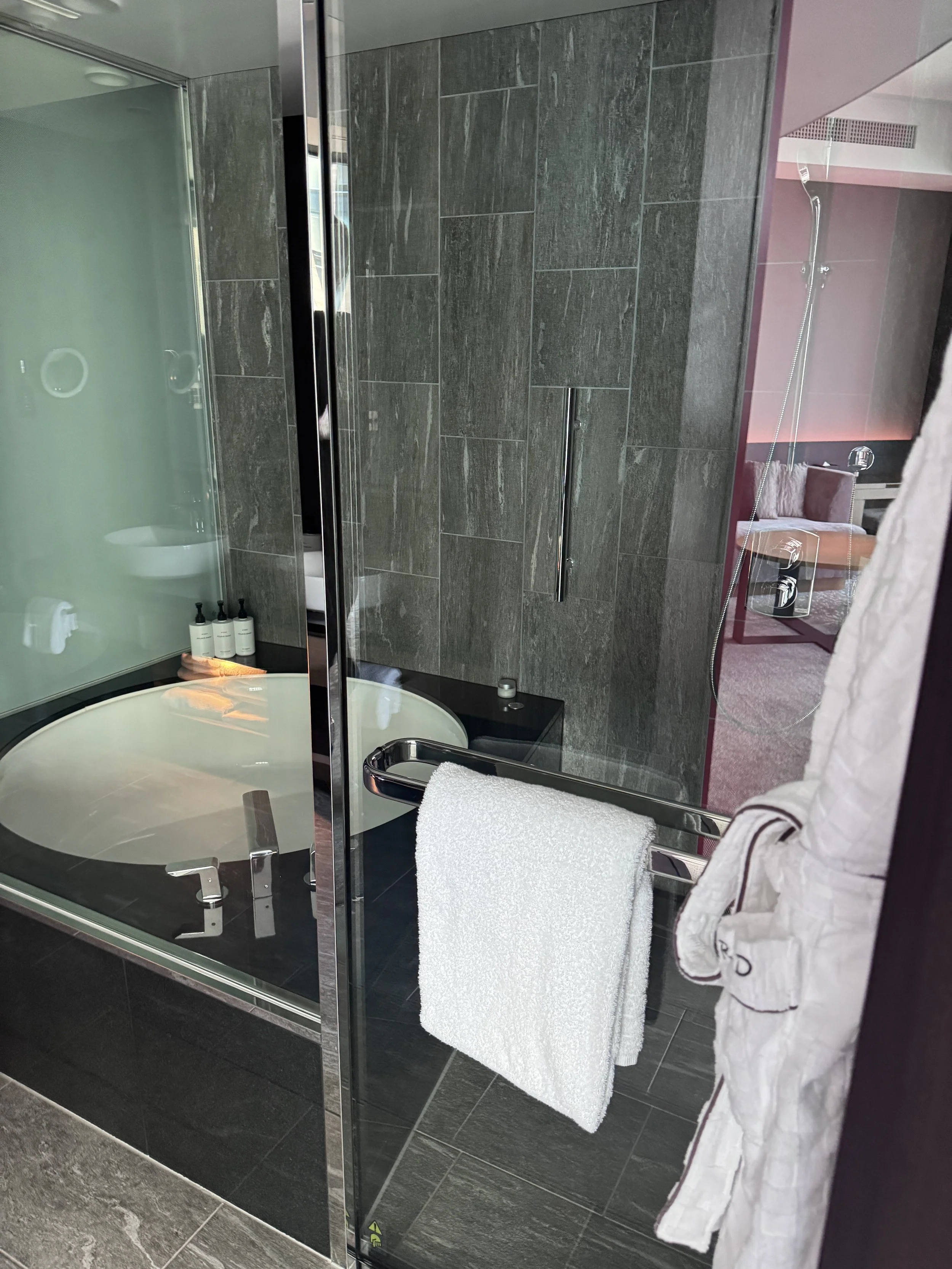 Deep soaking bathtub in a Conrad Osaka guest room bathroom