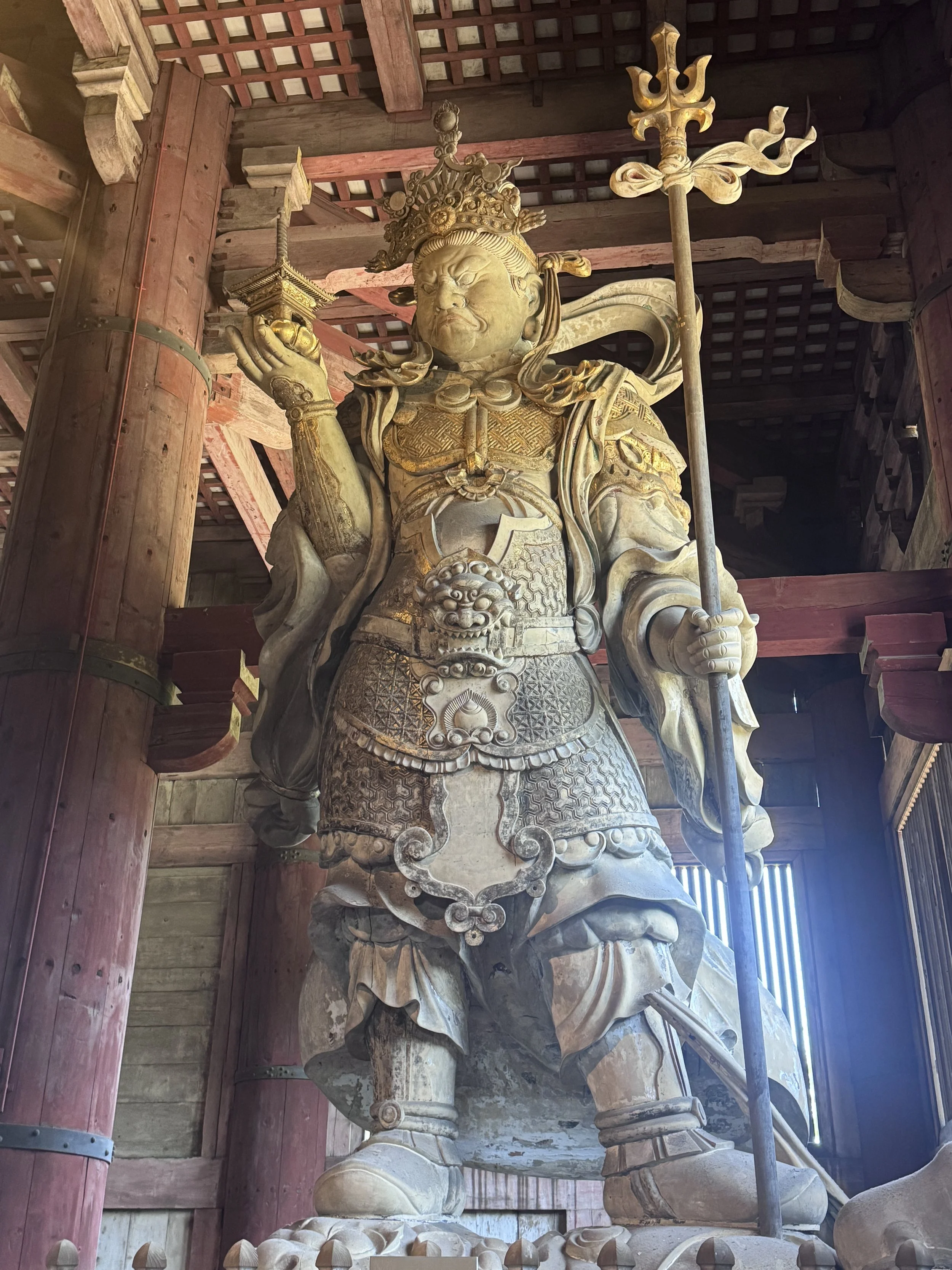 Ancient wooden guardian statue inside Nandaimon Gate at Todai-ji Temple in Nara