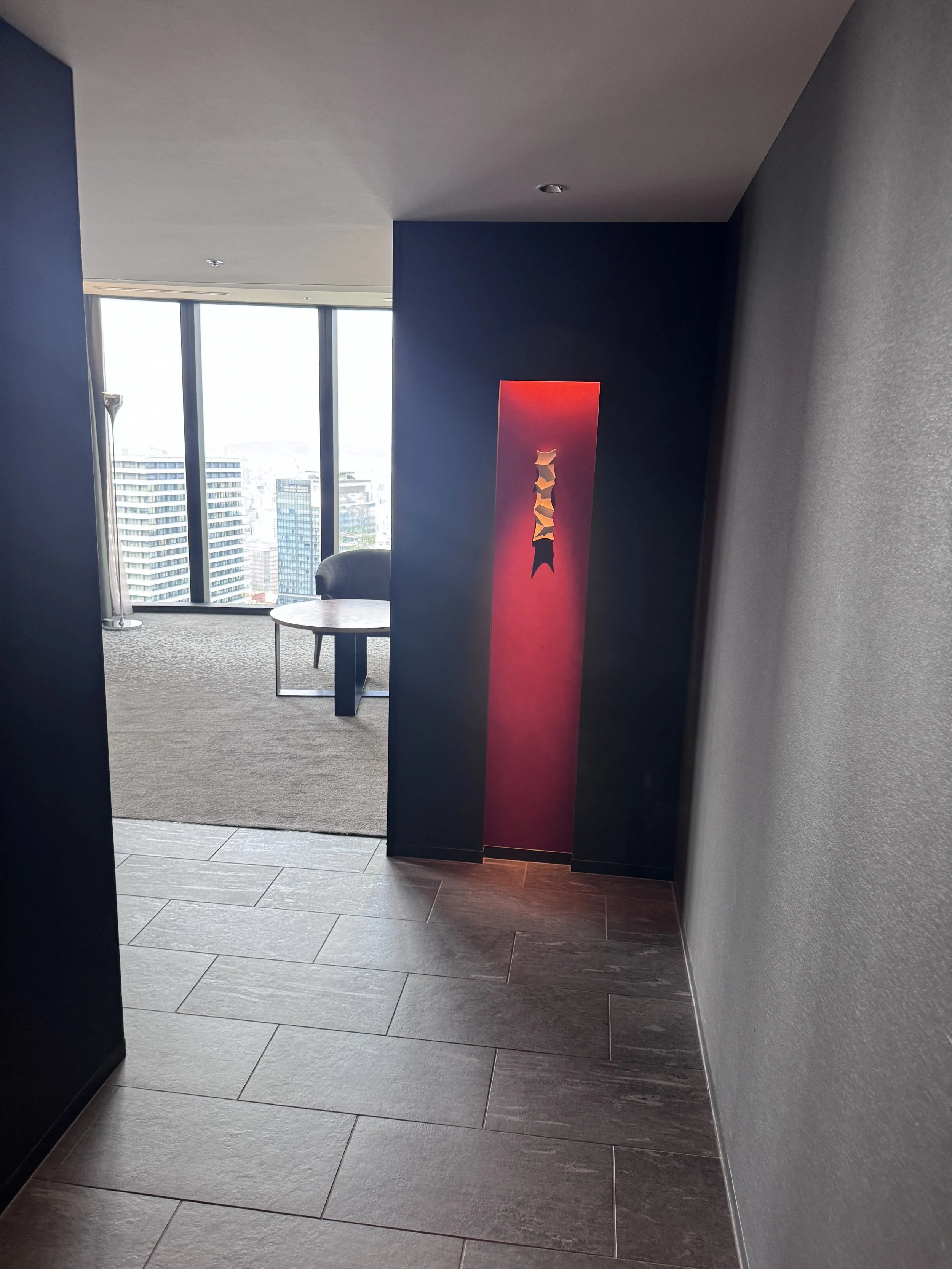 Entry hallway leading into a luxury guest room at Conrad Osaka