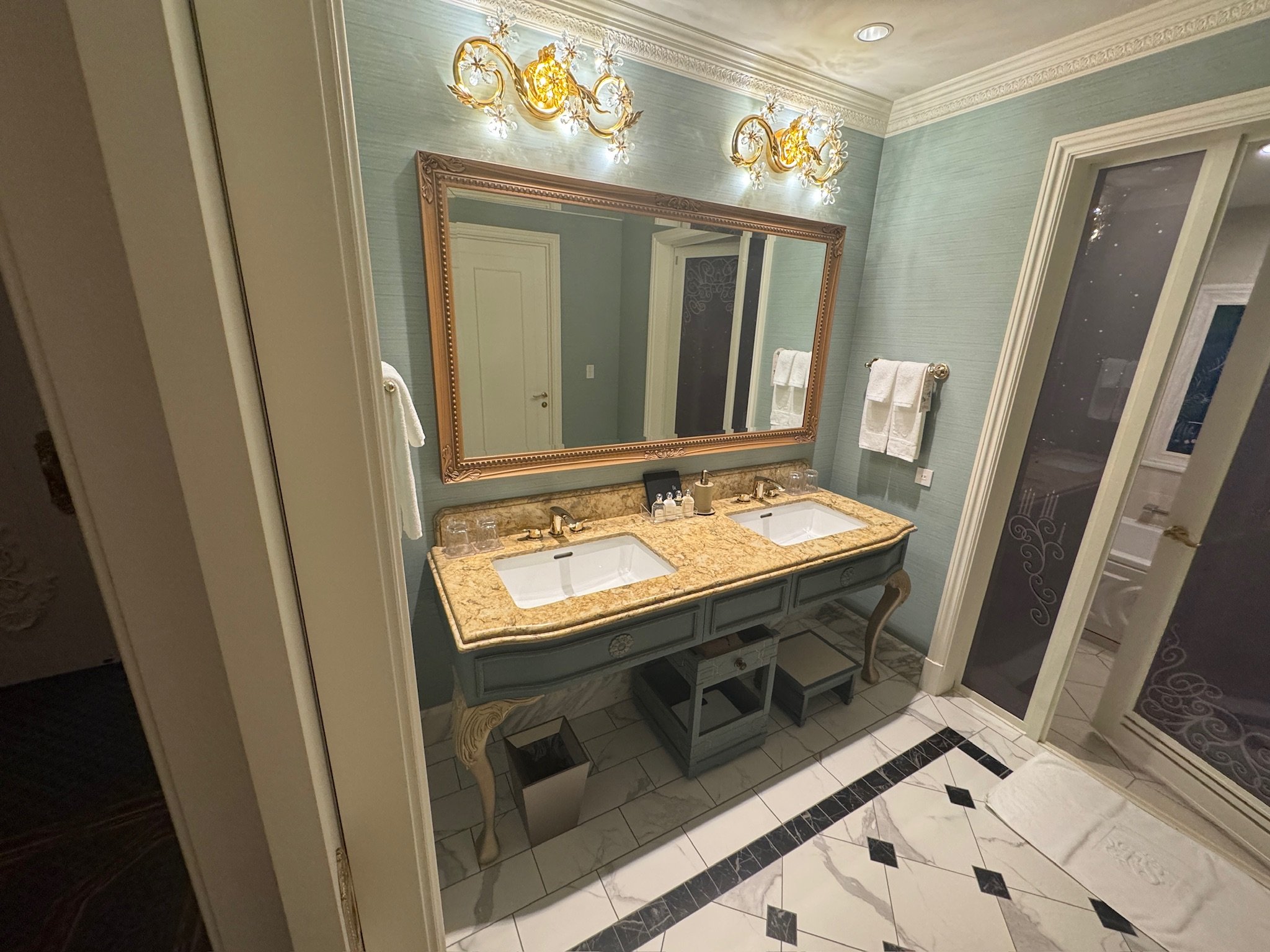 Tokyo Disney signature suite bathroom with double vanity marble floors and ornate mirror