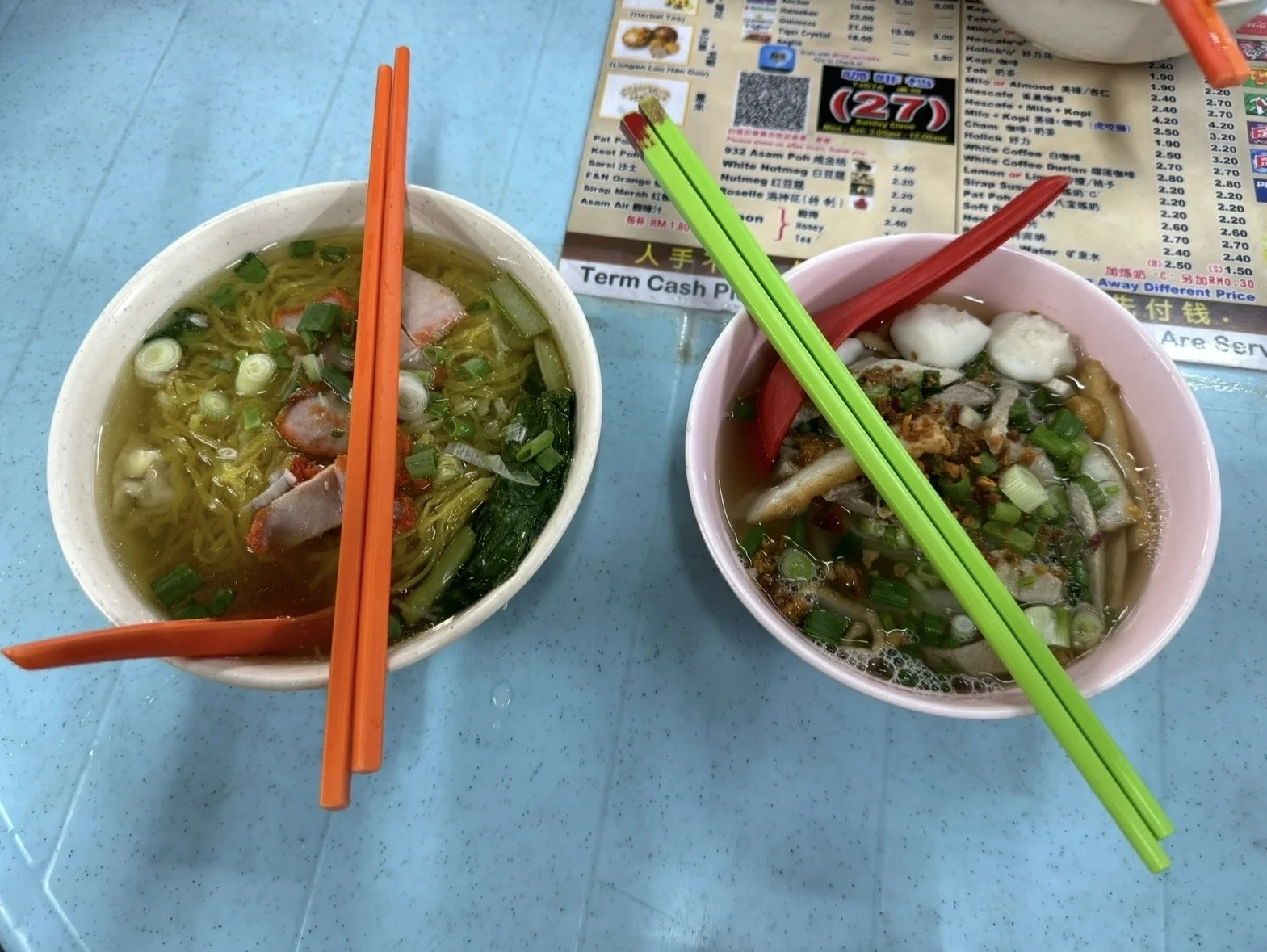 Bowls of Penang Hokkien Mee noodle soup at a local hawker stall
