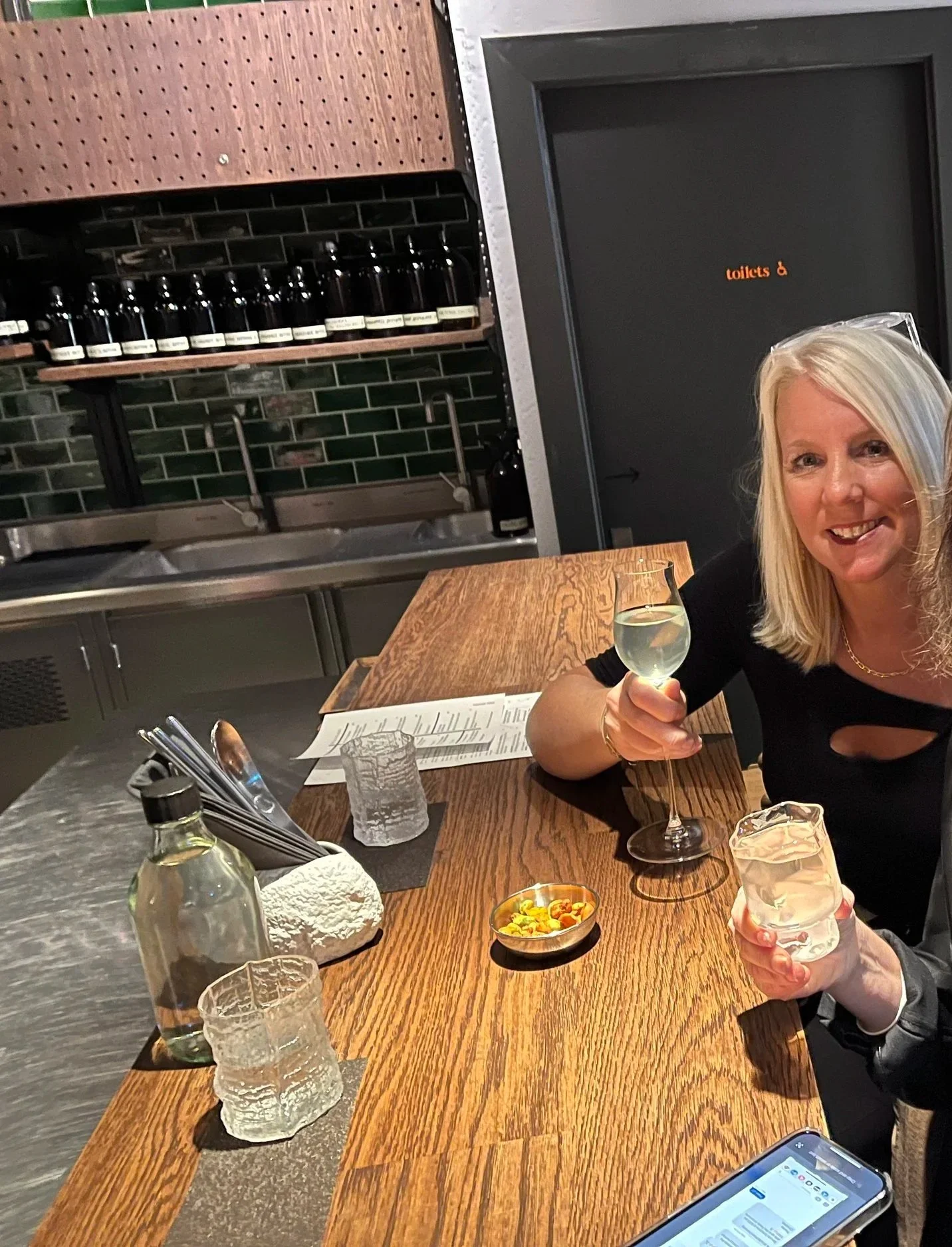 Guest enjoying cocktails at Elementary, the casual front bar of Tayer + Elementary in London.