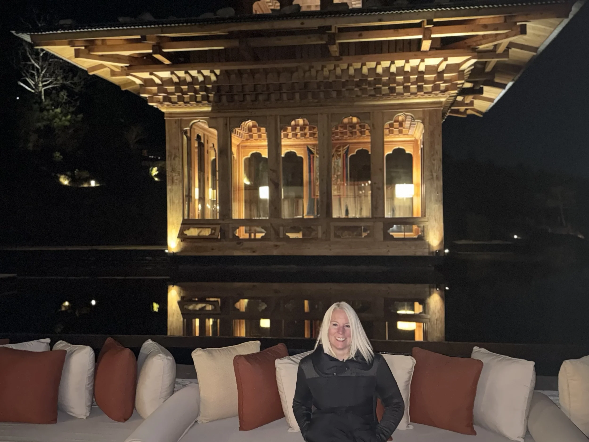 Six Senses Thimphu lodge illuminated at night in Bhutan