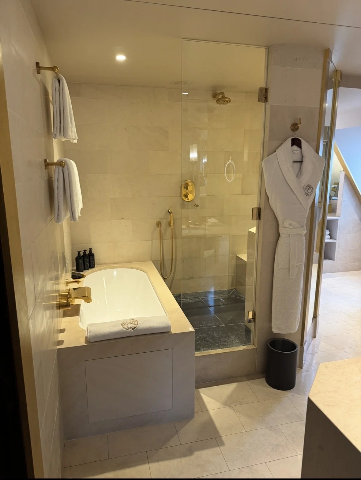Park Hyatt Paris marble bathroom with soaking tub and gold fixtures