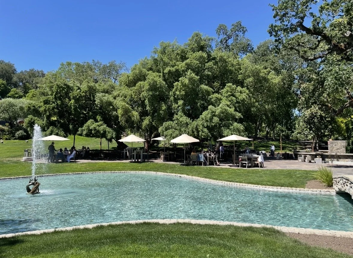 Far Niente gardens and pond surrounded by vineyards in Oakville