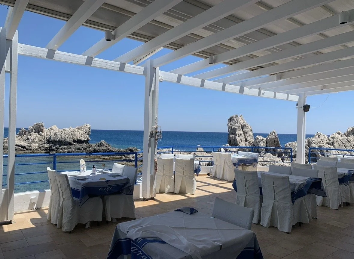 Waterfront dining terrace overlooking the sea at Argo Seafood Restaurant