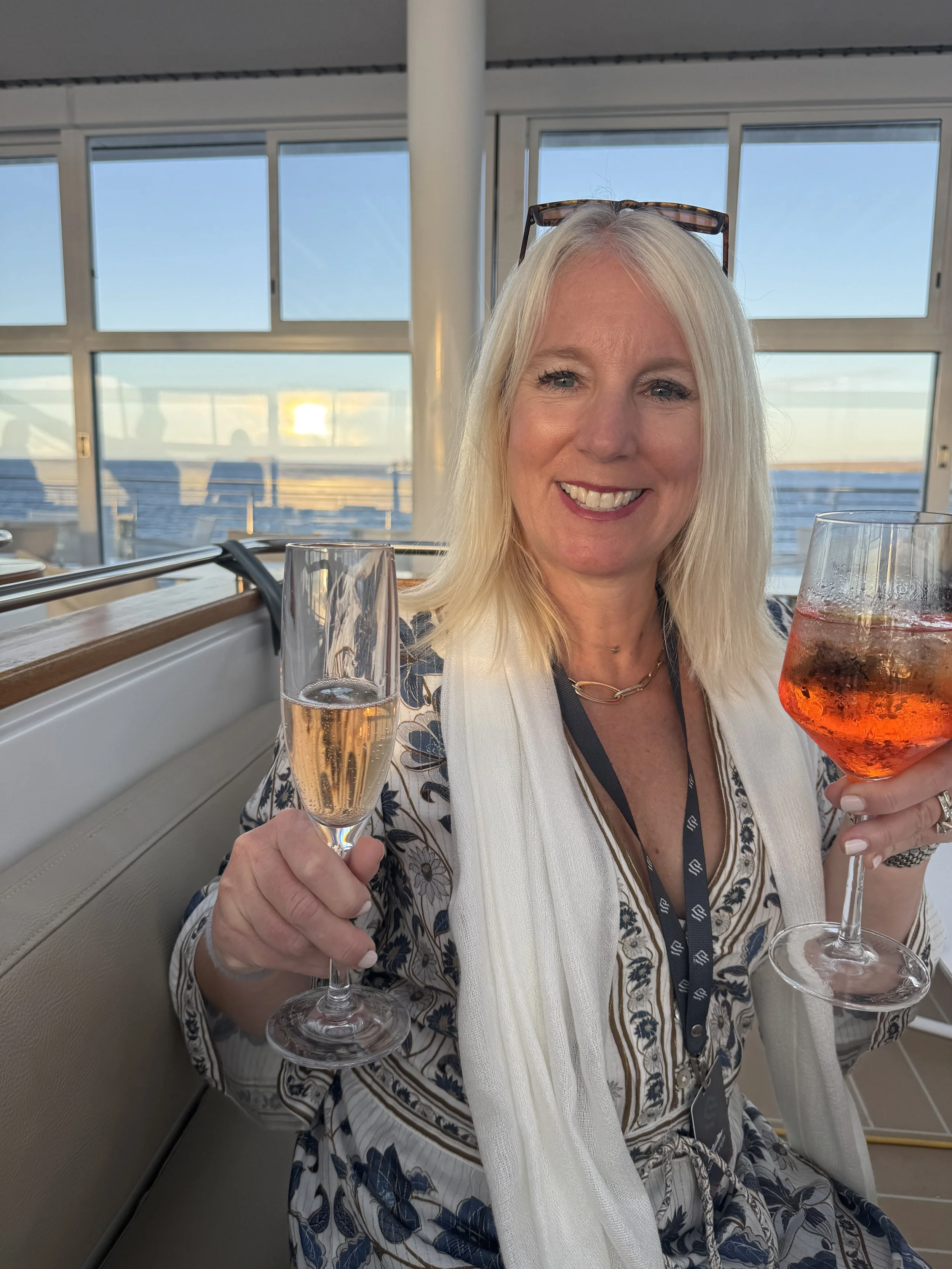 Enjoying champagne at sunset aboard the Silversea Silver Origin Galápagos expedition cruise