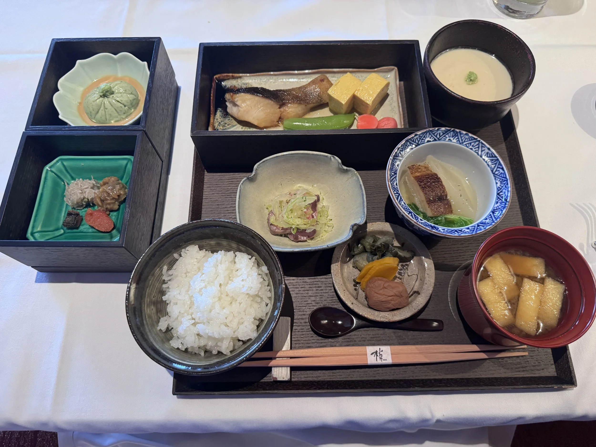 Japanese breakfast featuring grilled fish, rice, miso soup, and seasonal side dishes at Park Hyatt Tokyo.