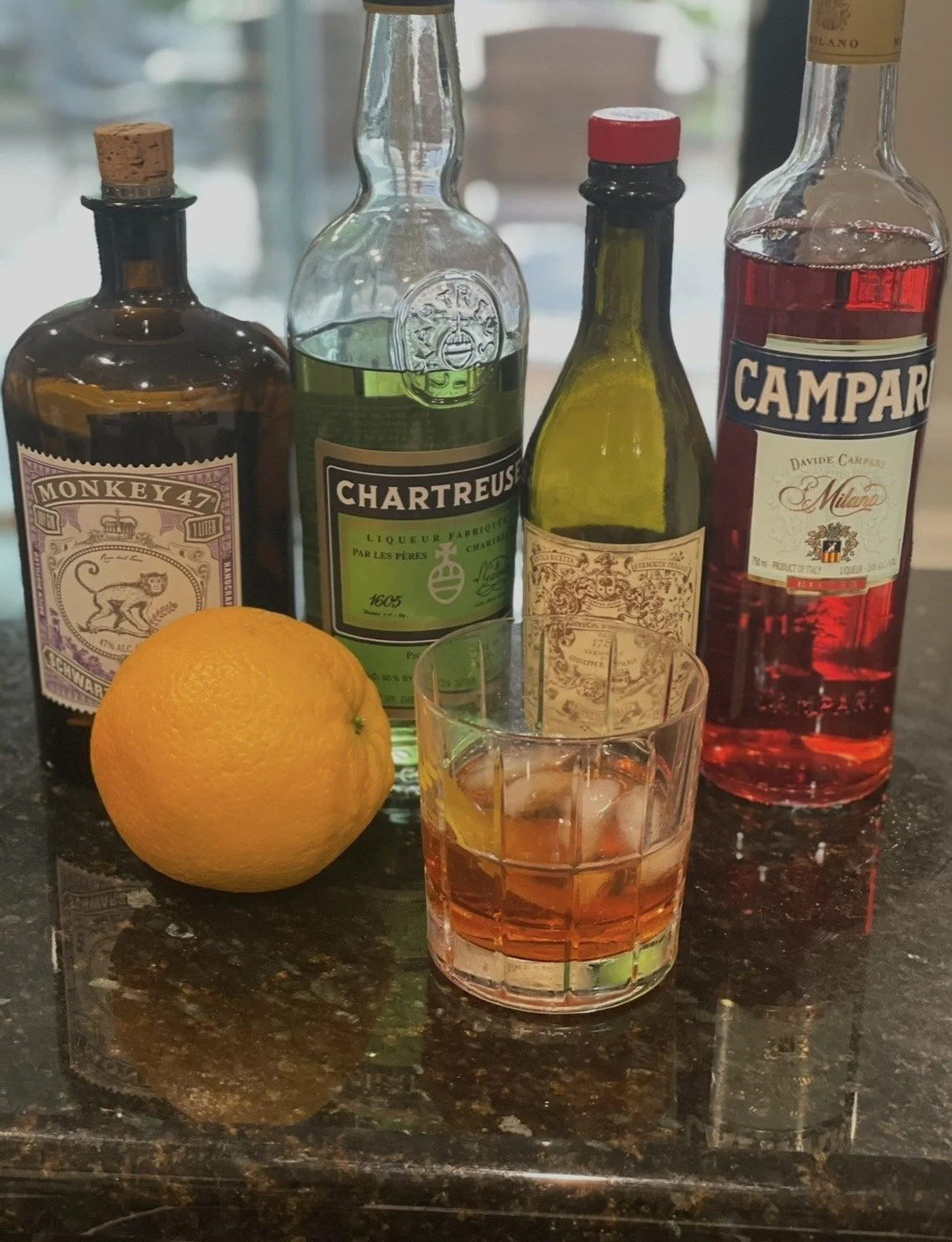 Bijou cocktail variation with gin, sweet vermouth, Green Chartreuse and Campari