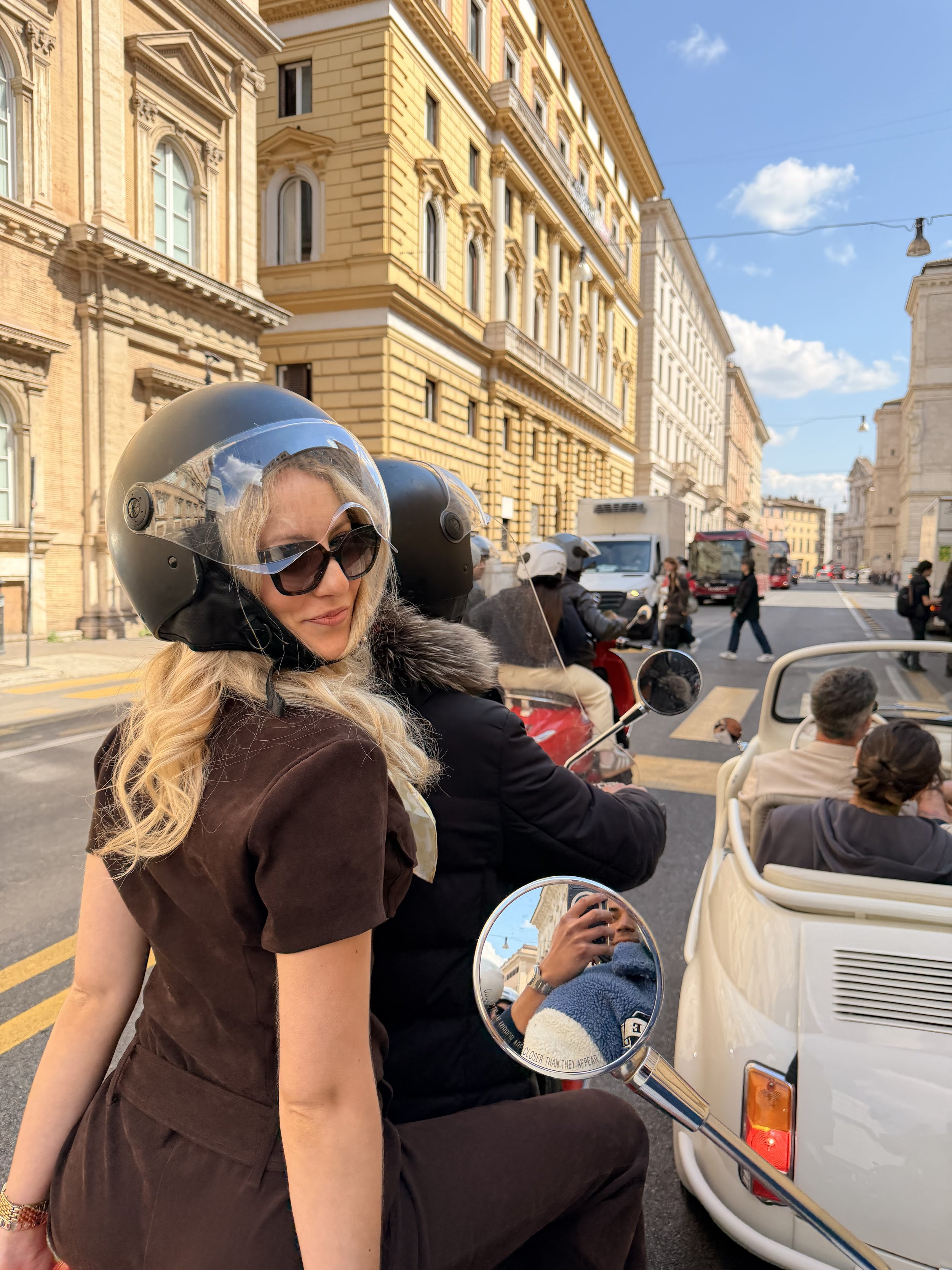 Exploring Rome on a vintage Vespa through the city's historic streets.